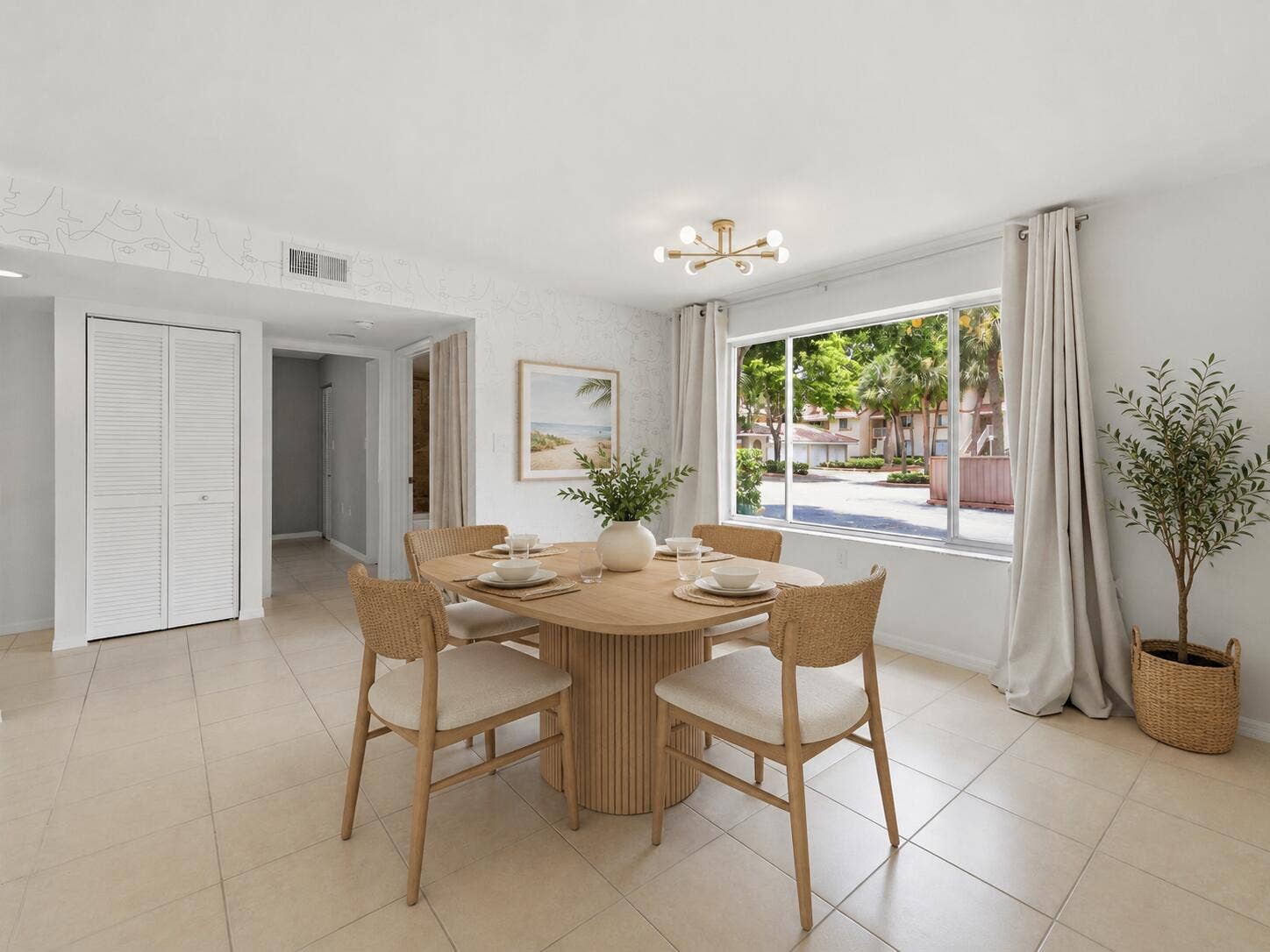 20101 Glenmoor Drive, West Palm Beach, West Palm Beach, FL 33409 Bright living space featuring large format tile flooring, a modern sputnik light fixture, and a wide window with exterior landscaping.