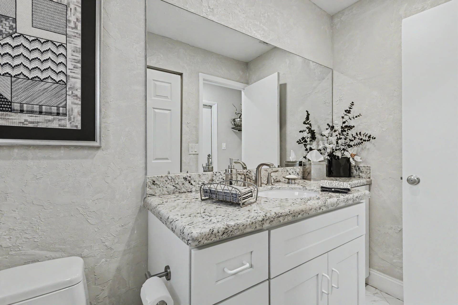 415 SAILBOAT Circle, Weston, FL 33326 Powder room off living room with laundry clean.