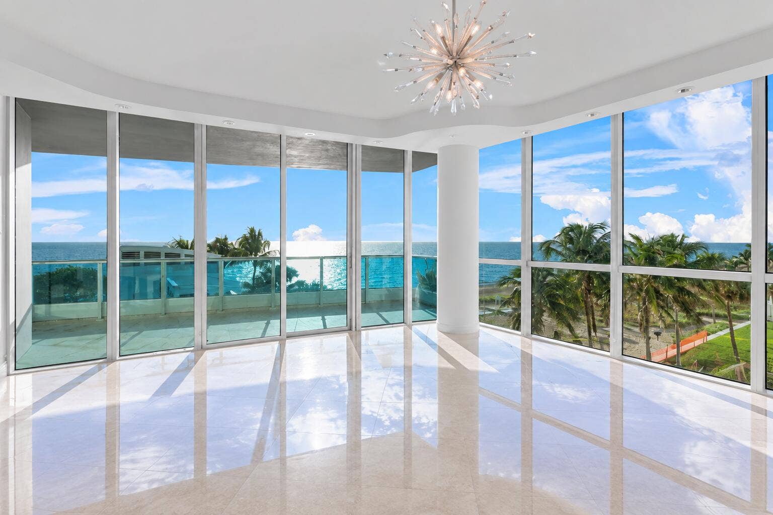 Sunlit Coastal Living Room with Ocean Vi