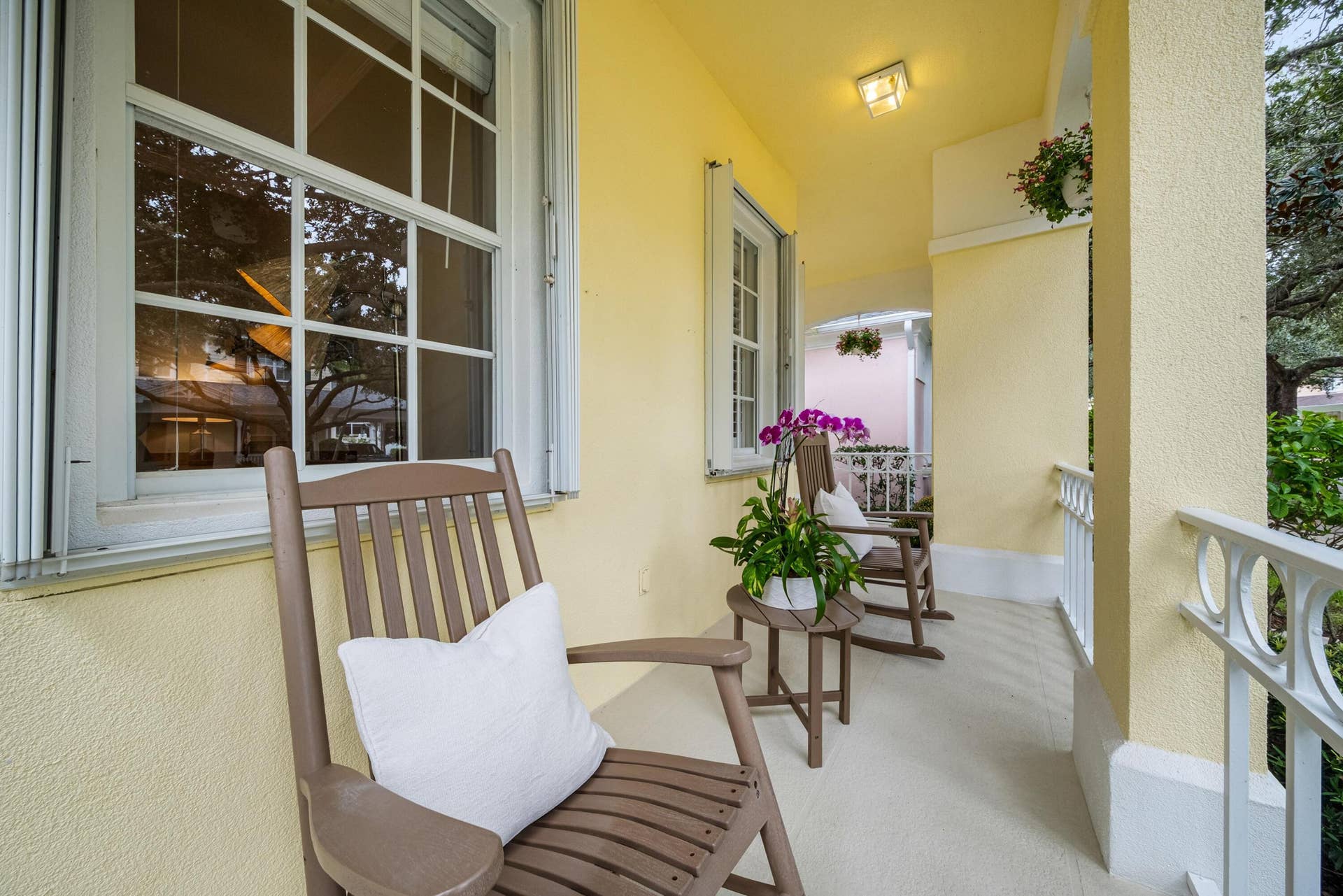 254 Marlberry Circle, Jupiter, FL 33458 Covered front porch with room for seating, overlooking the oak-lined street