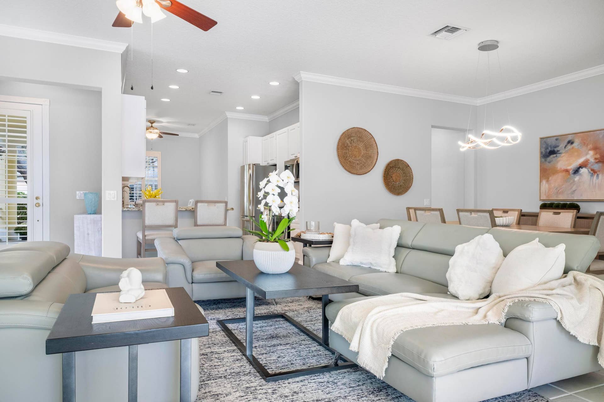 254 Marlberry Circle, Jupiter, FL 33458 Living room, dining room and kitchen flowing together in one open layout
