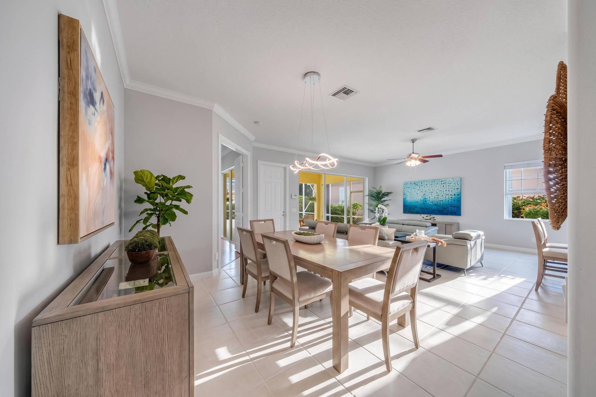 254 Marlberry Circle, Jupiter, FL 33458 Dining room and sight-lines through the living room and the covered and screened patio
