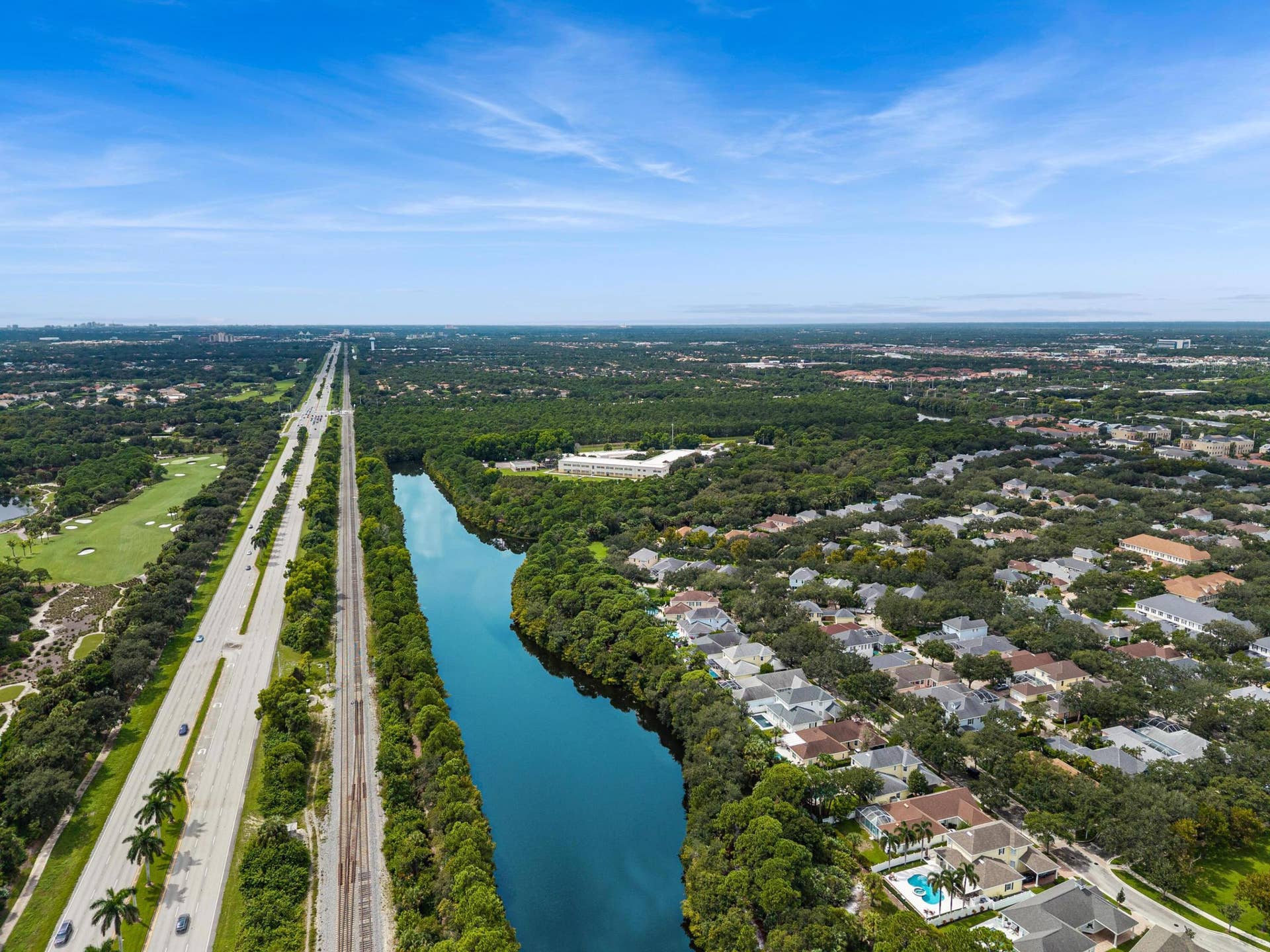 254 Marlberry Circle, Jupiter, FL 33458 Aerial showing a nearby lake, golf course and preserve land