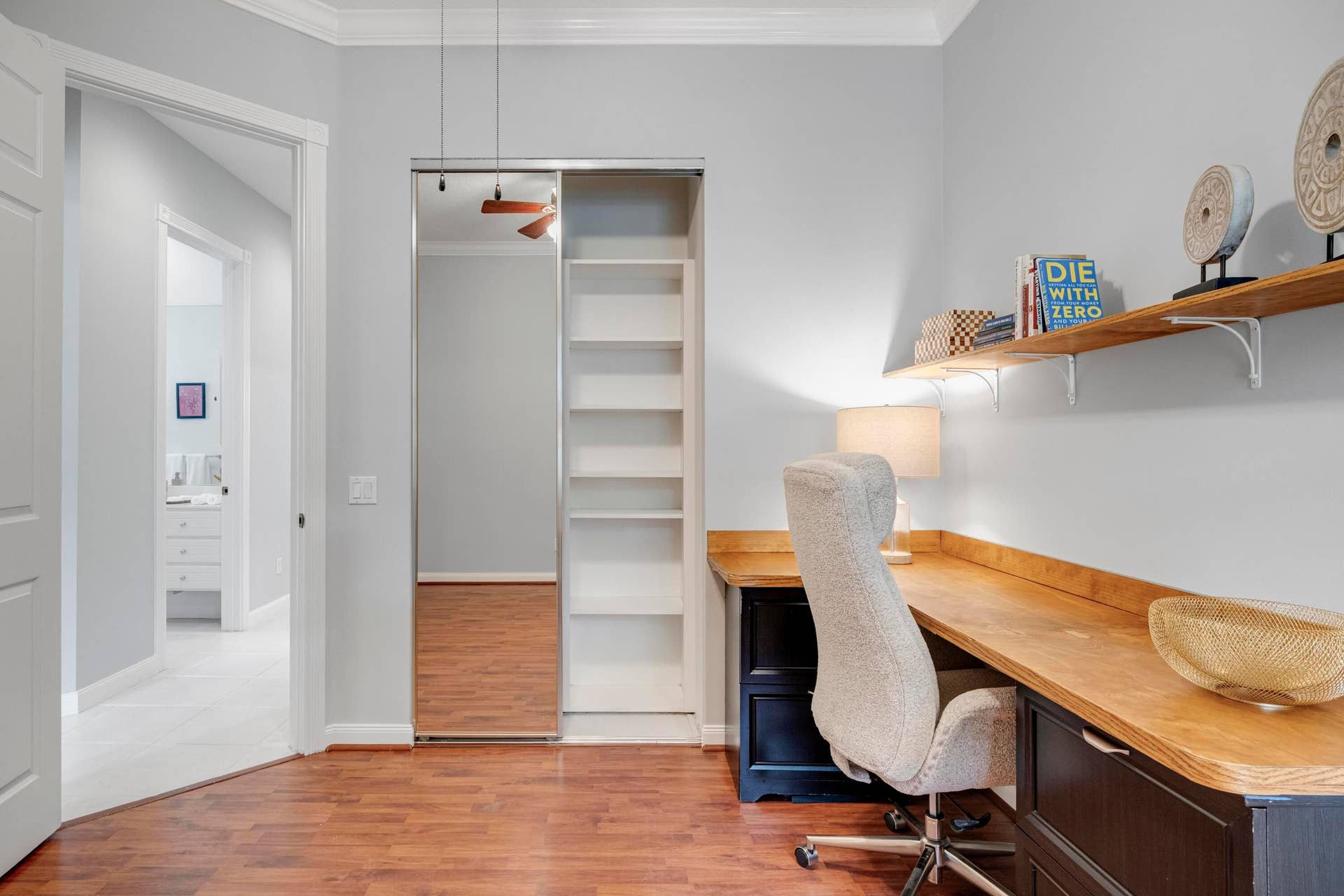 254 Marlberry Circle, Jupiter, FL 33458 Bedroom closet with built-in shelving, with the bathroom just across the hall