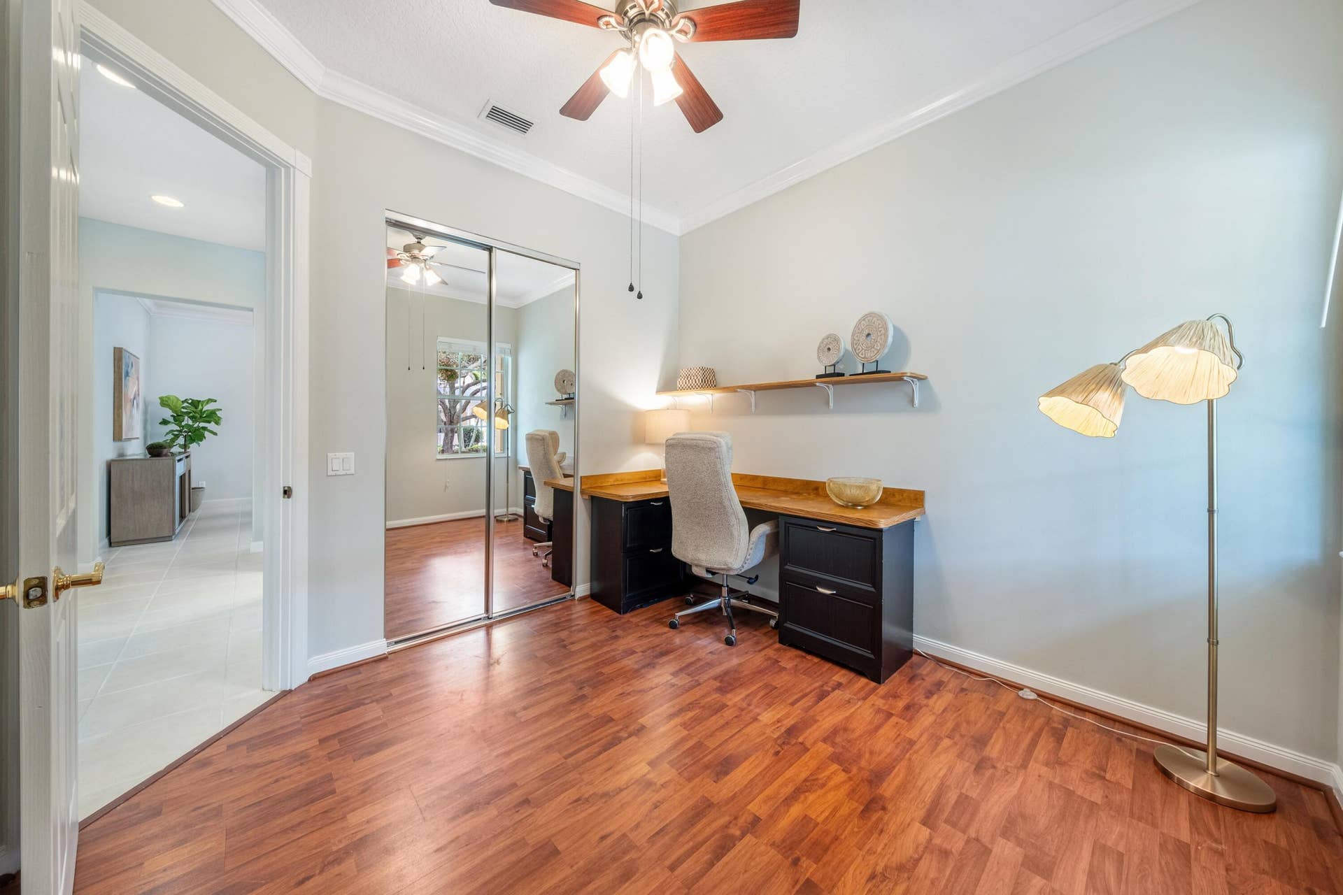 254 Marlberry Circle, Jupiter, FL 33458 Bedroom with mirrored closet doors and direct access to the hallway