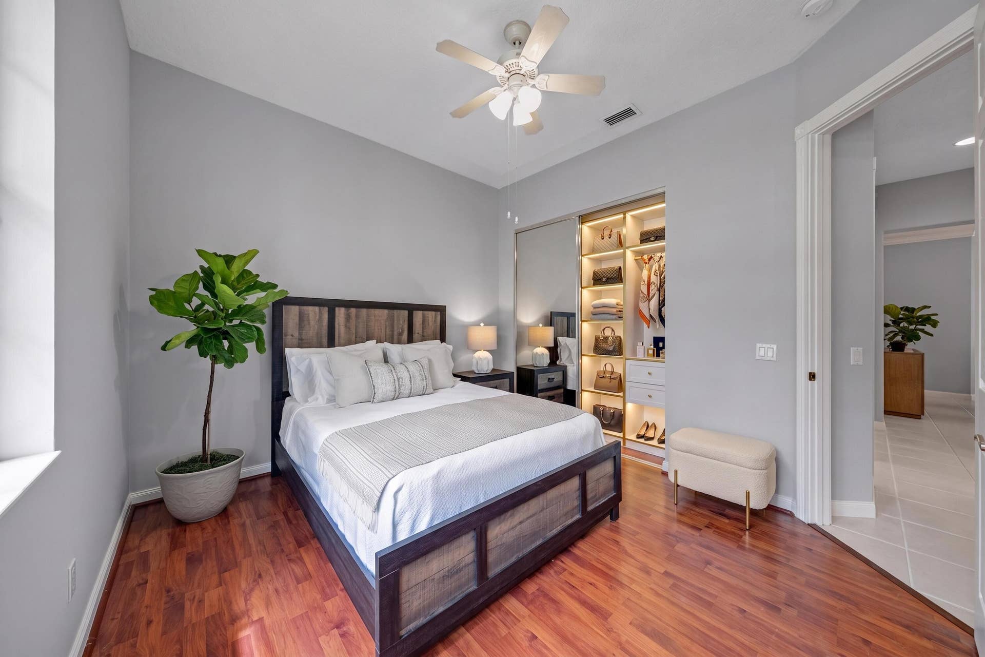 254 Marlberry Circle, Jupiter, FL 33458 Bedroom with built-in closet shelving, set just off the hallway (closet virtually staged)