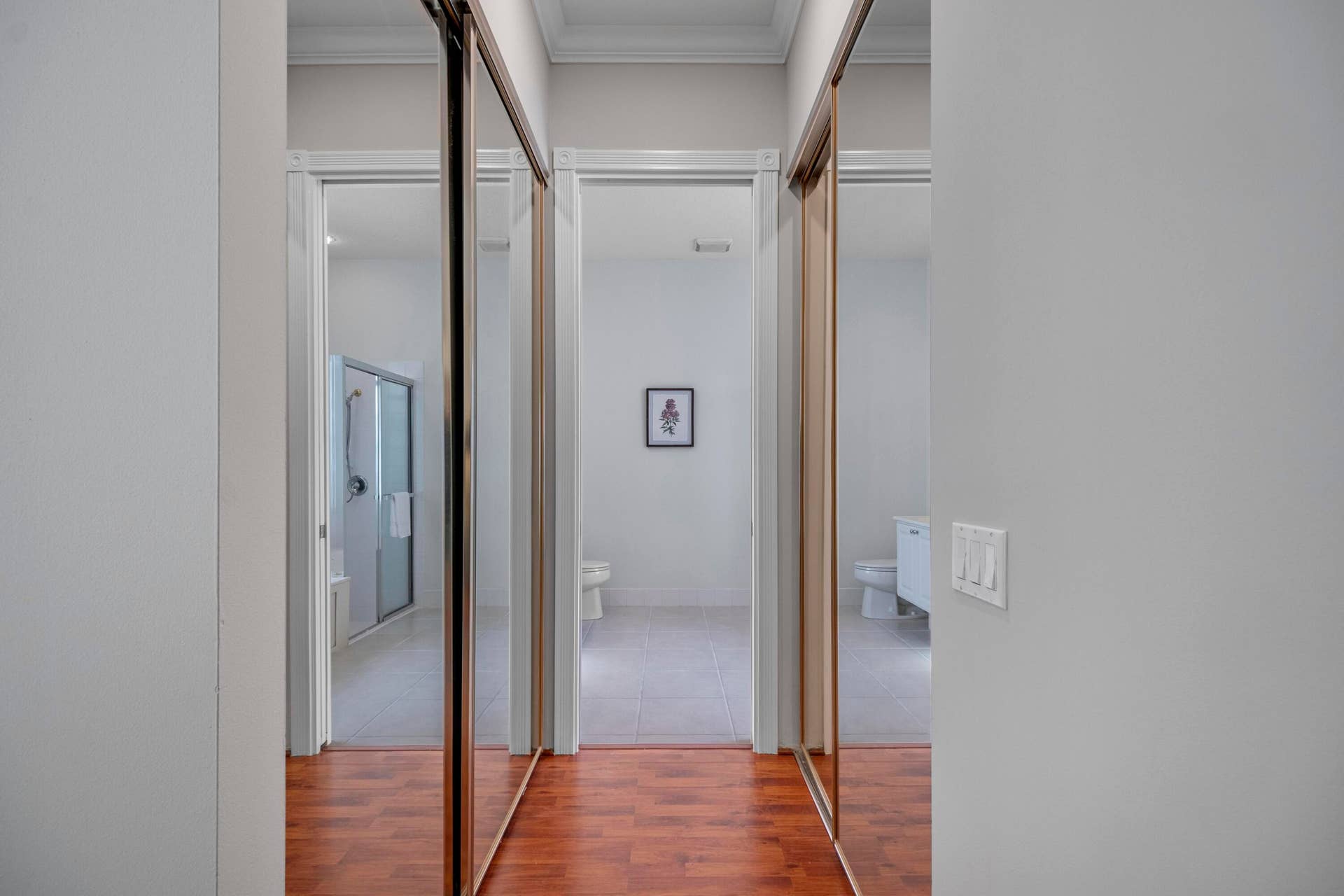 254 Marlberry Circle, Jupiter, FL 33458 Passage to the primary bathroom, flanked by mirrored primary closets