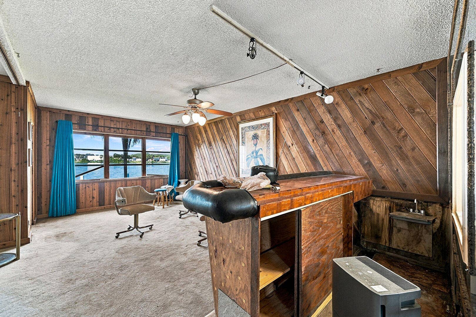 4311 CRYSTAL LAKE Drive, #110, Deerfield Beach, FL 33064 Ceiling Fan, Indoor Bar, Textured Ceiling, Track Lighting, Water View, Waterfront, Wood Wall, Smoke Carbon Monoxide Detector