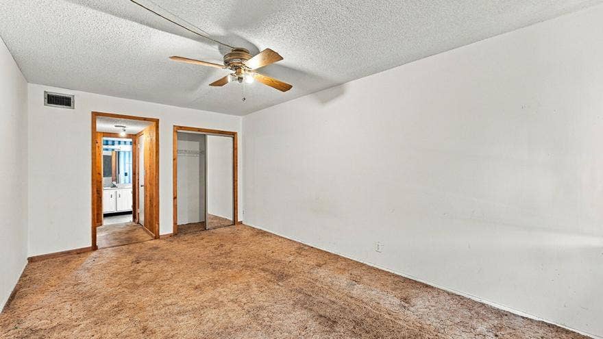 4311 CRYSTAL LAKE Drive, #110, Deerfield Beach, FL 33064 Recessed lighting, wood-finish trim, ceiling fan, and sliding closet door