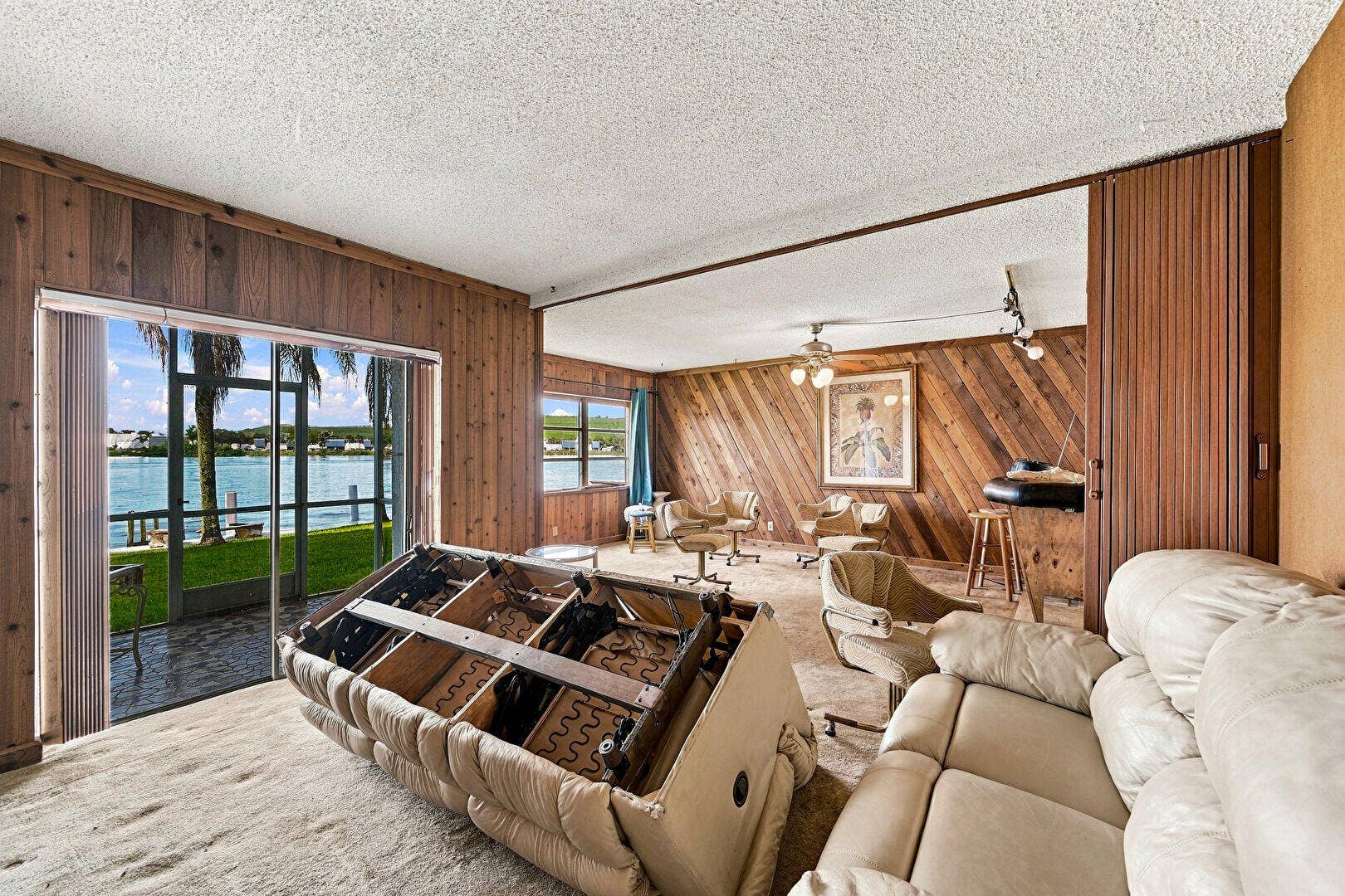 4311 CRYSTAL LAKE Drive, #110, Deerfield Beach, FL 33064 Access To Exterior, Ceiling Fan, Water View, Waterfront, Wood Wall, Textured Ceiling