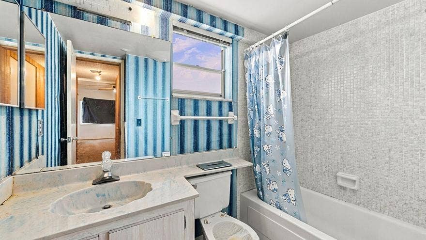 4311 CRYSTAL LAKE Drive, #110, Deerfield Beach, FL 33064 Combined Bath Shower, Full Bathroom, Tile Floor, Vanity, Wallpaper Wall, Full Bathroom, Tile Wall