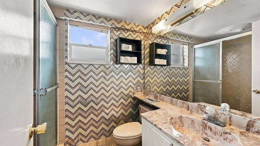 4311 CRYSTAL LAKE Drive, #110, Deerfield Beach, FL 33064 Combined Bath Shower, Full Bathroom, Tile Floor, Vanity, Wallpaper Wall, Full Bathroom, Tile Wall