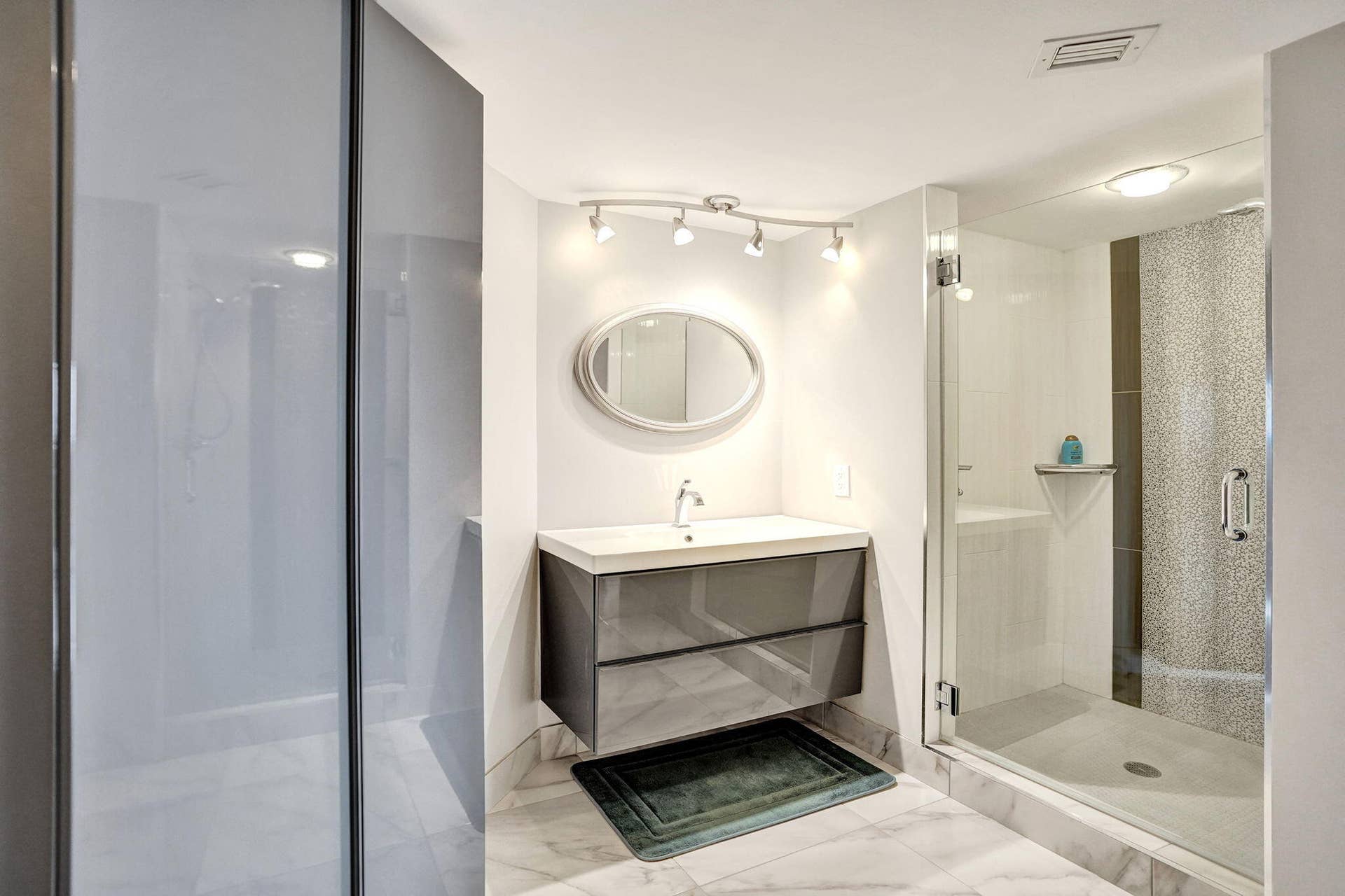 Primary bath with glass-enclosed shower