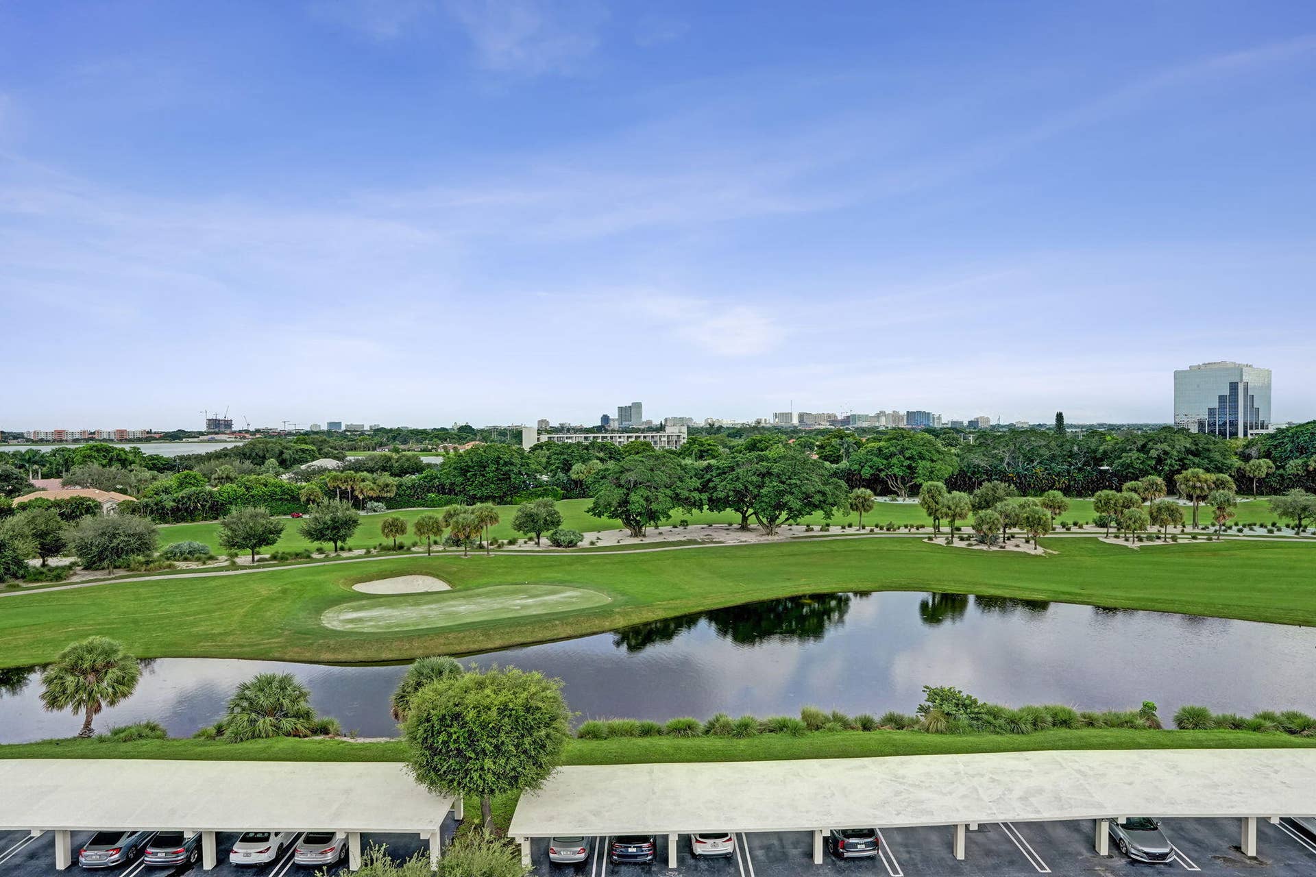 Wide golf-course and lake panorama