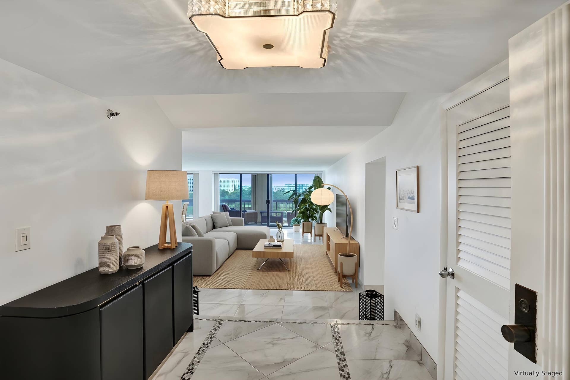 Virtually staged using AI  entry foyer and living room