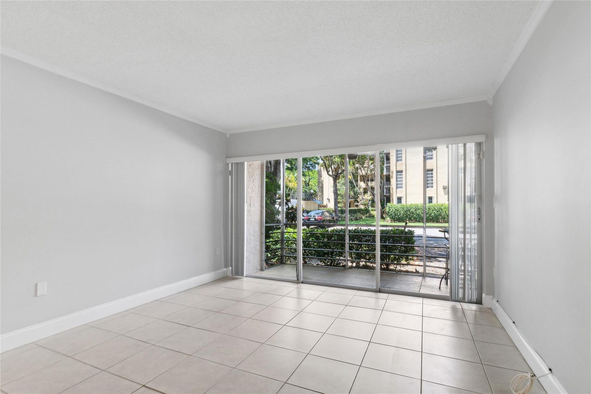Light and bright living area opens to screened porch