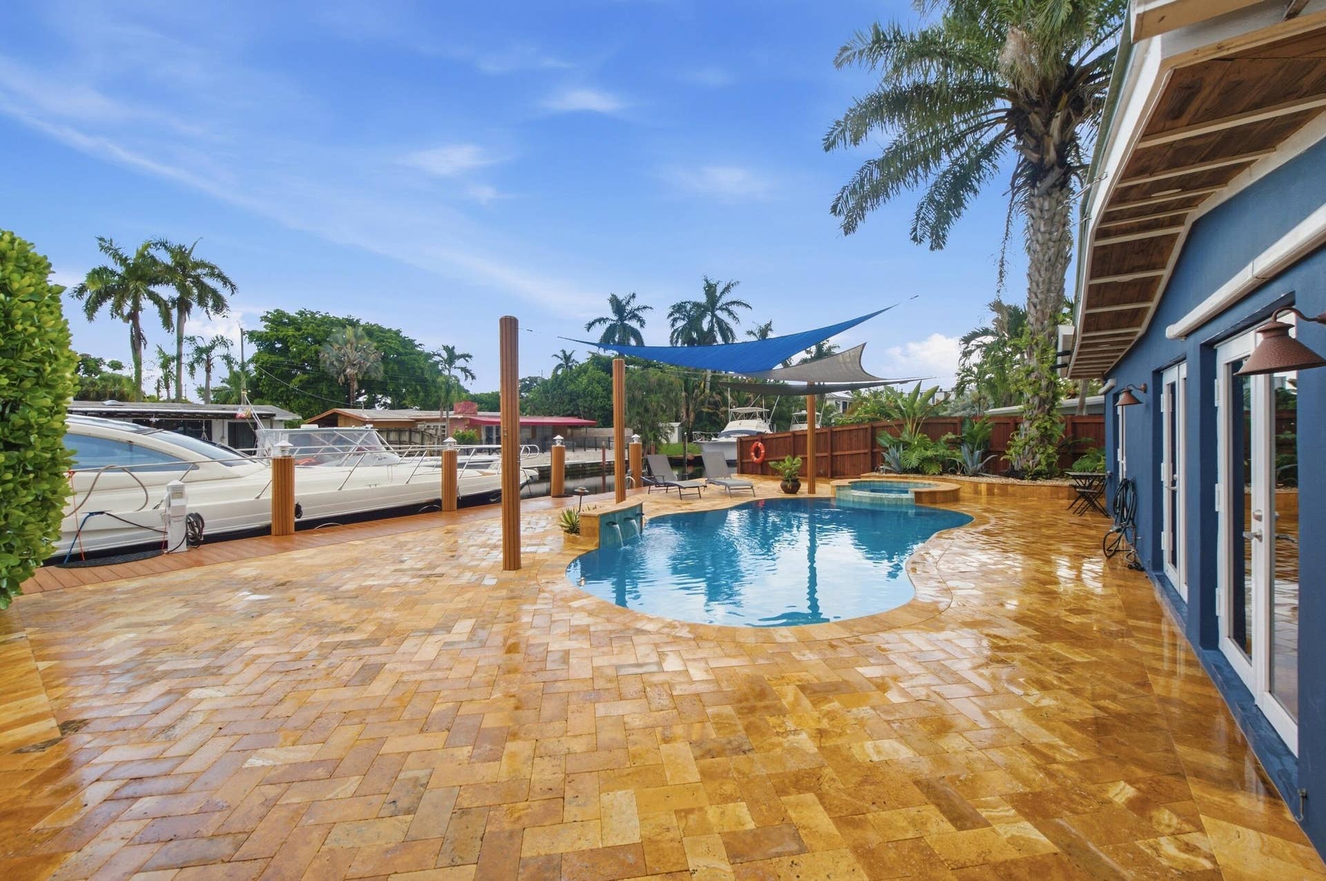 2496 BIMINI Lane, Fort Lauderdale, FL 33312 Freeform pool, surrounding patio, and waterfront access with dock