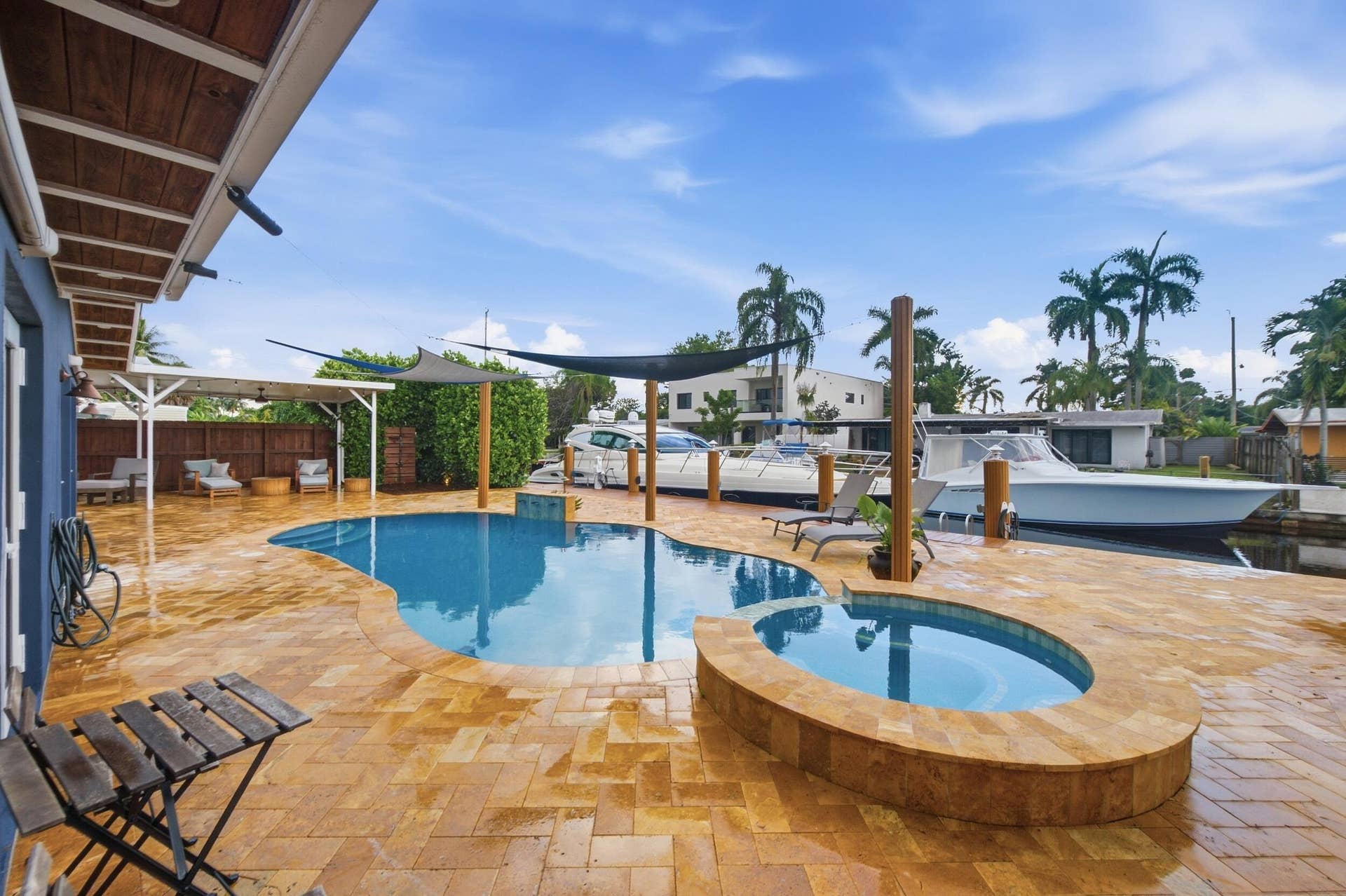 2496 BIMINI Lane, Fort Lauderdale, FL 33312 Freeform swimming pool with integrated spa and extensive paver patio