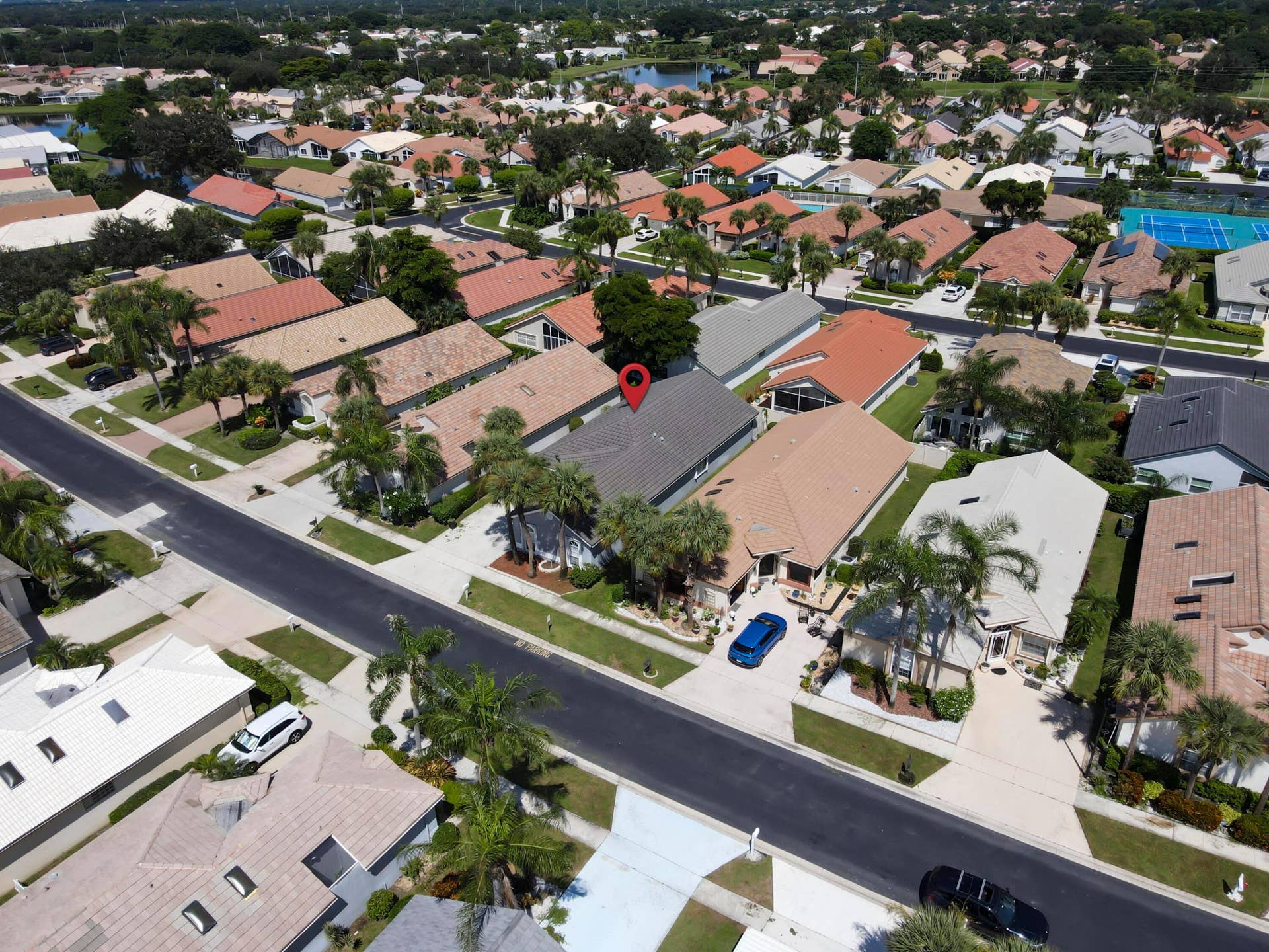 6162 BAY ISLES Drive, Boynton Beach, FL 33437 Aerial perspective of a residential neighborhood with a variety of single-story homes, many featuring tile roofs
