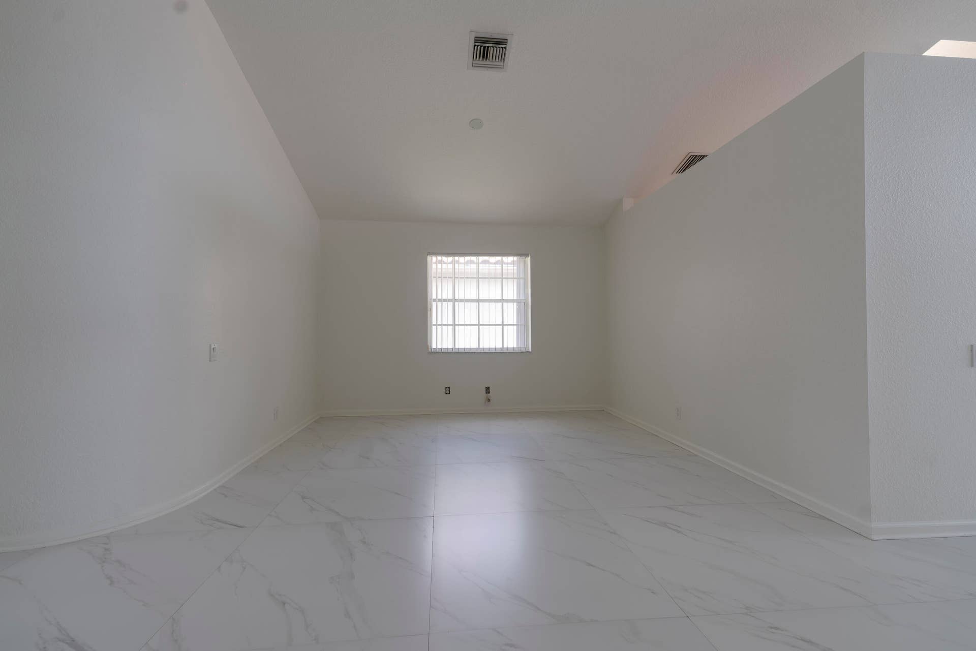 6162 BAY ISLES Drive, Boynton Beach, FL 33437 White tile flooring with subtle veining, single window with blinds, and white painted walls