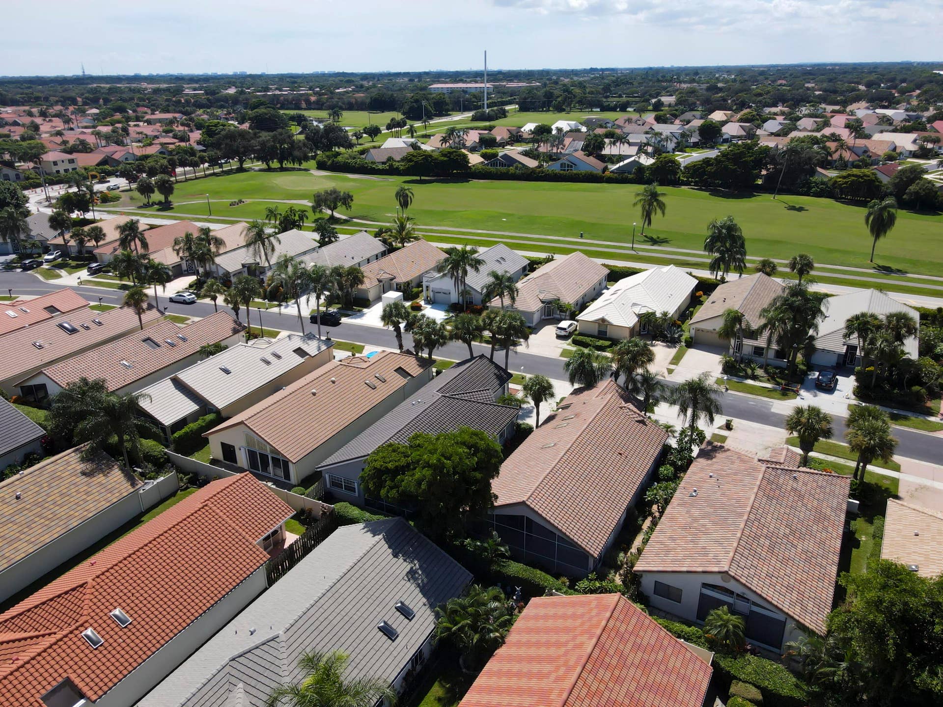 6162 BAY ISLES Drive, Boynton Beach, FL 33437 Residential properties featuring varied roof styles, landscaping, and paved driveways