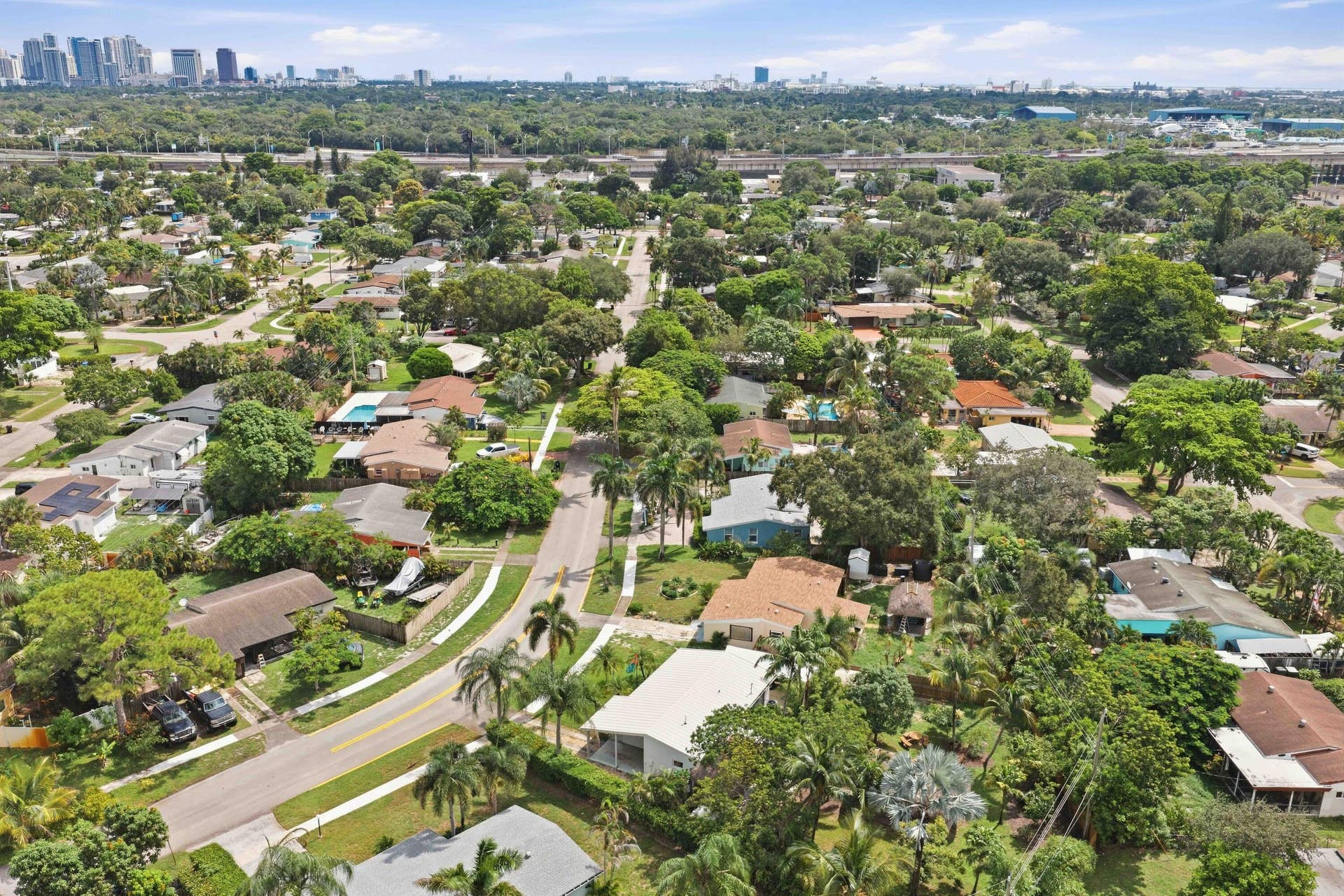 Expansive aerial perspective showcasing a residential area with mature landscaping