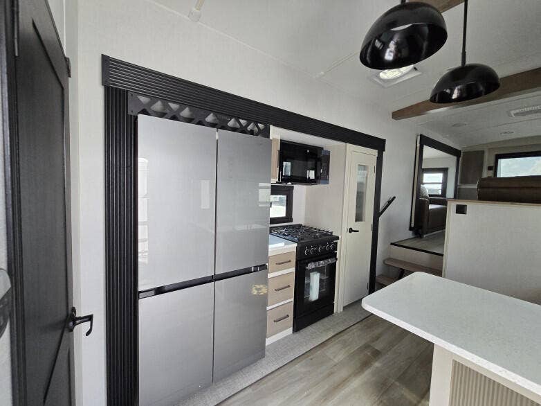 930 Rambling Drive Circle, #LITTLE RANCHES, Wellington, FL 33414 RV: Full-size double-door fridge freezer, full-size gas stove top and oven with microwave above.