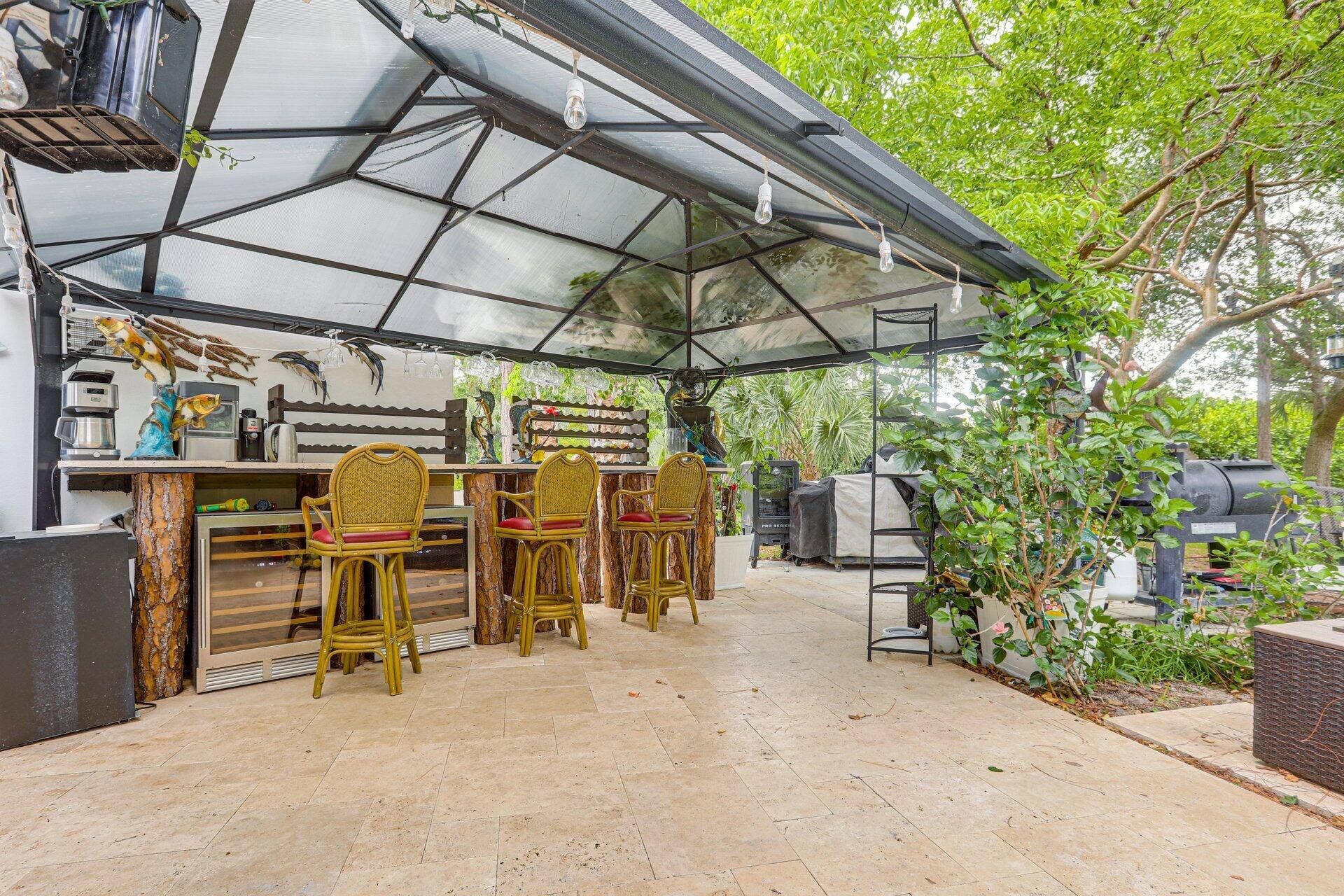 930 Rambling Drive Circle, #LITTLE RANCHES, Wellington, FL 33414 Covered bar 14 feet 6 inches long with Terracotta marble top