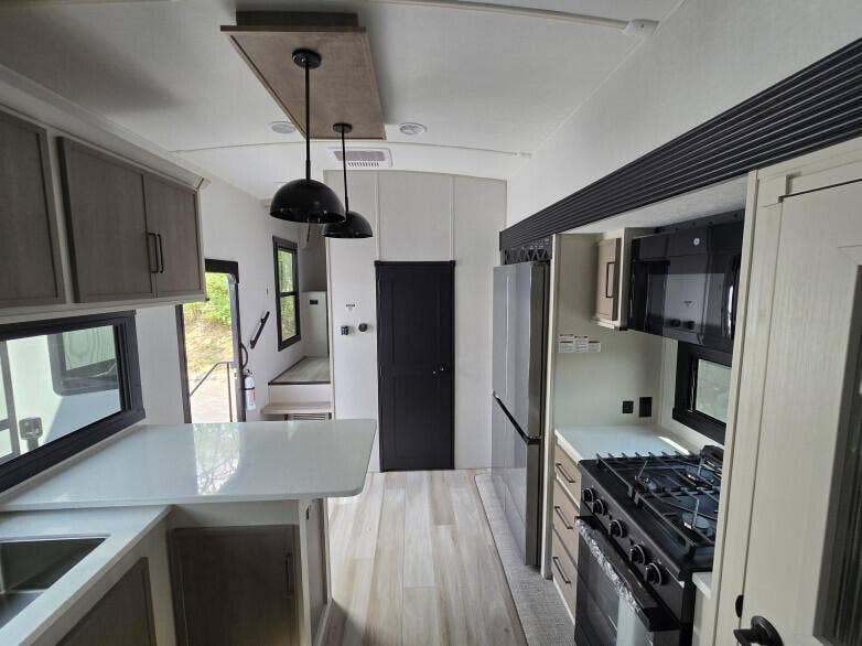 930 Rambling Drive Circle, #LITTLE RANCHES, Wellington, FL 33414 RV: Through view from kitchen with powder room to steps to master bedroom with en suite bathroom