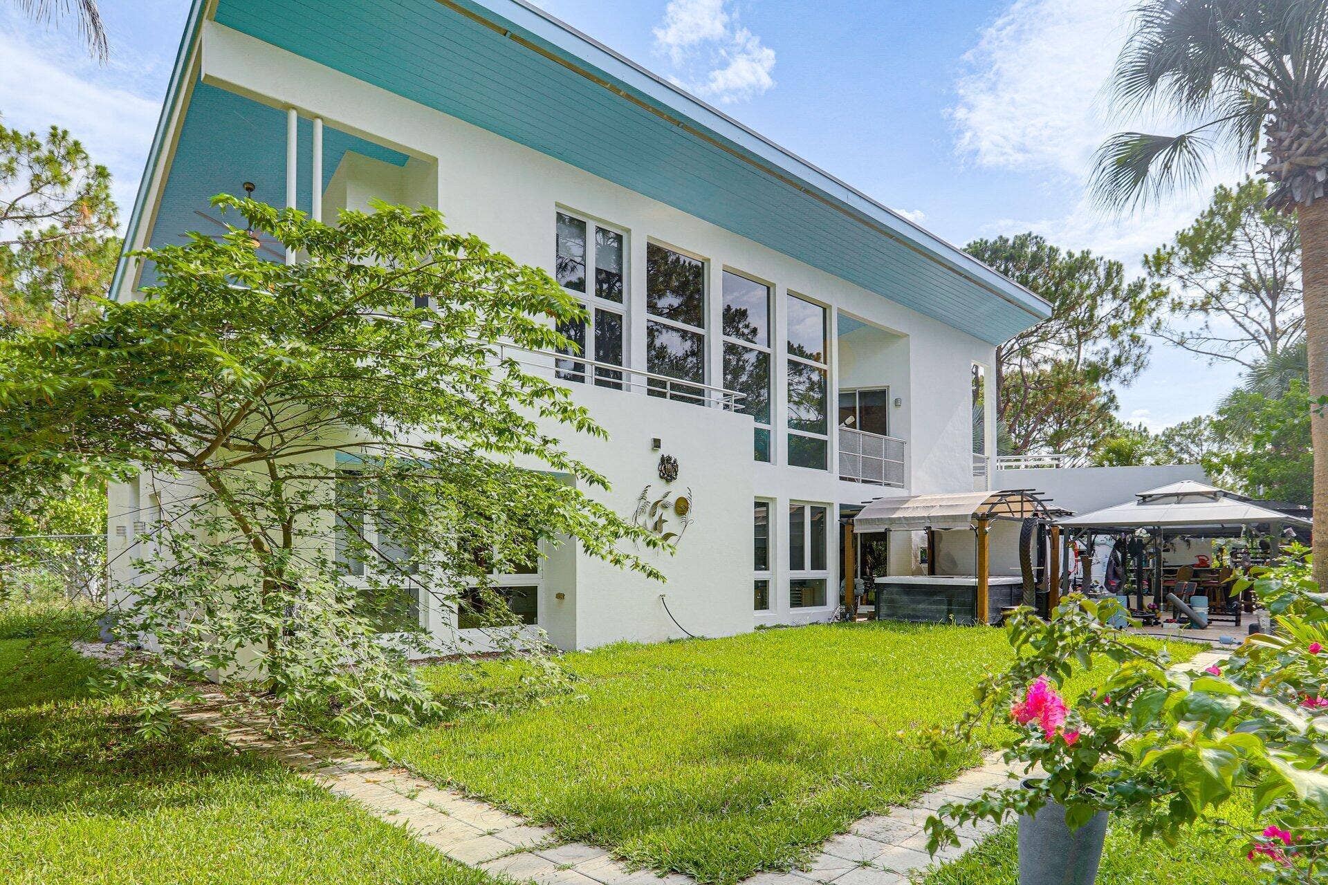 930 Rambling Drive Circle, #LITTLE RANCHES, Wellington, FL 33414 NW view showing part of the covered outdoor Spa /Gym/Dining/Bar/ Kitchen BBQ area.