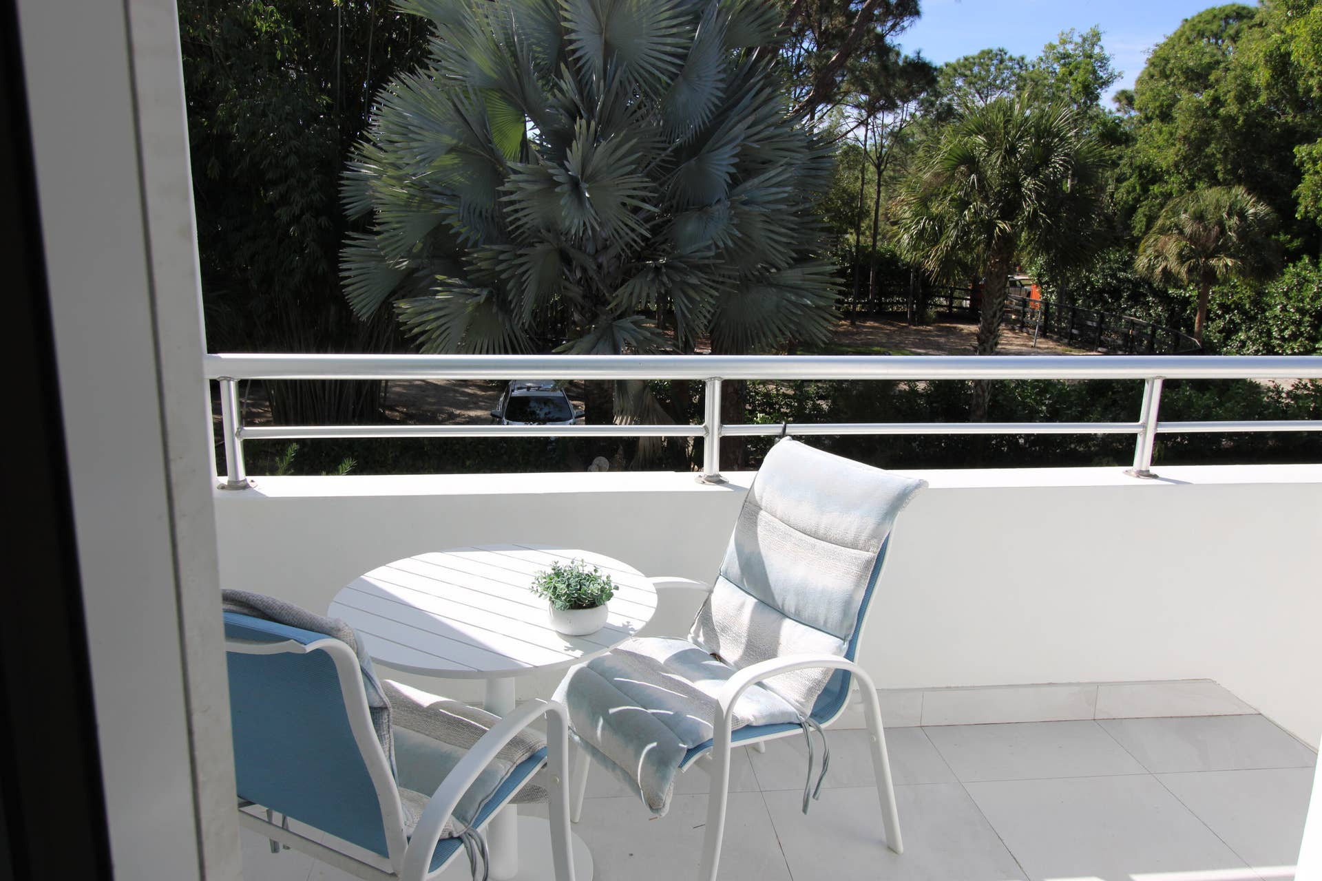 930 Rambling Drive Circle, #LITTLE RANCHES, Wellington, FL 33414 Royal Suite West balcony dining overlooking the second gate and a paddock fenced area