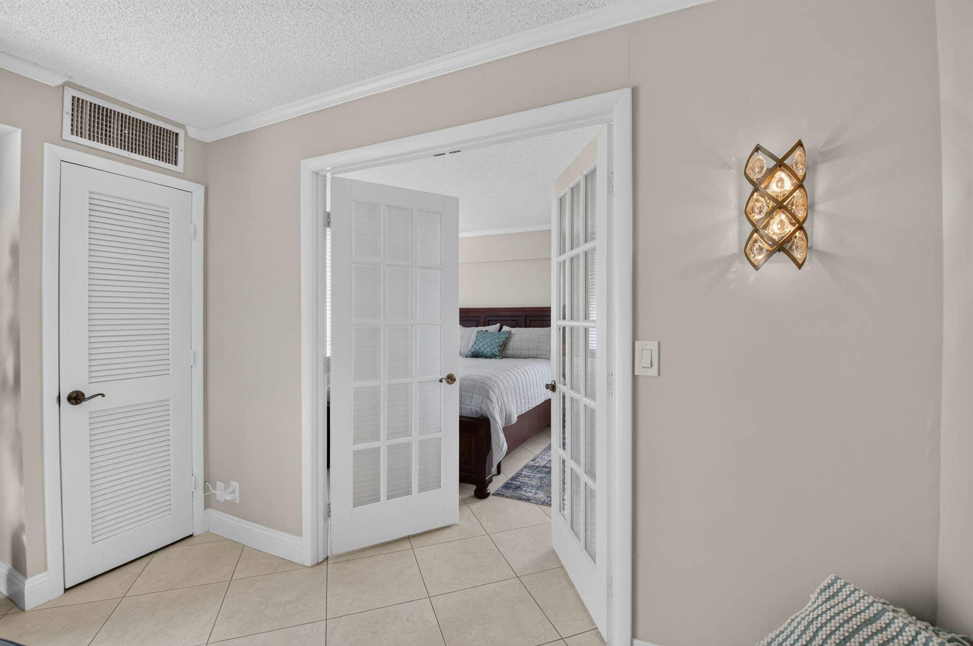 Double French door entry into 2nd bedroom