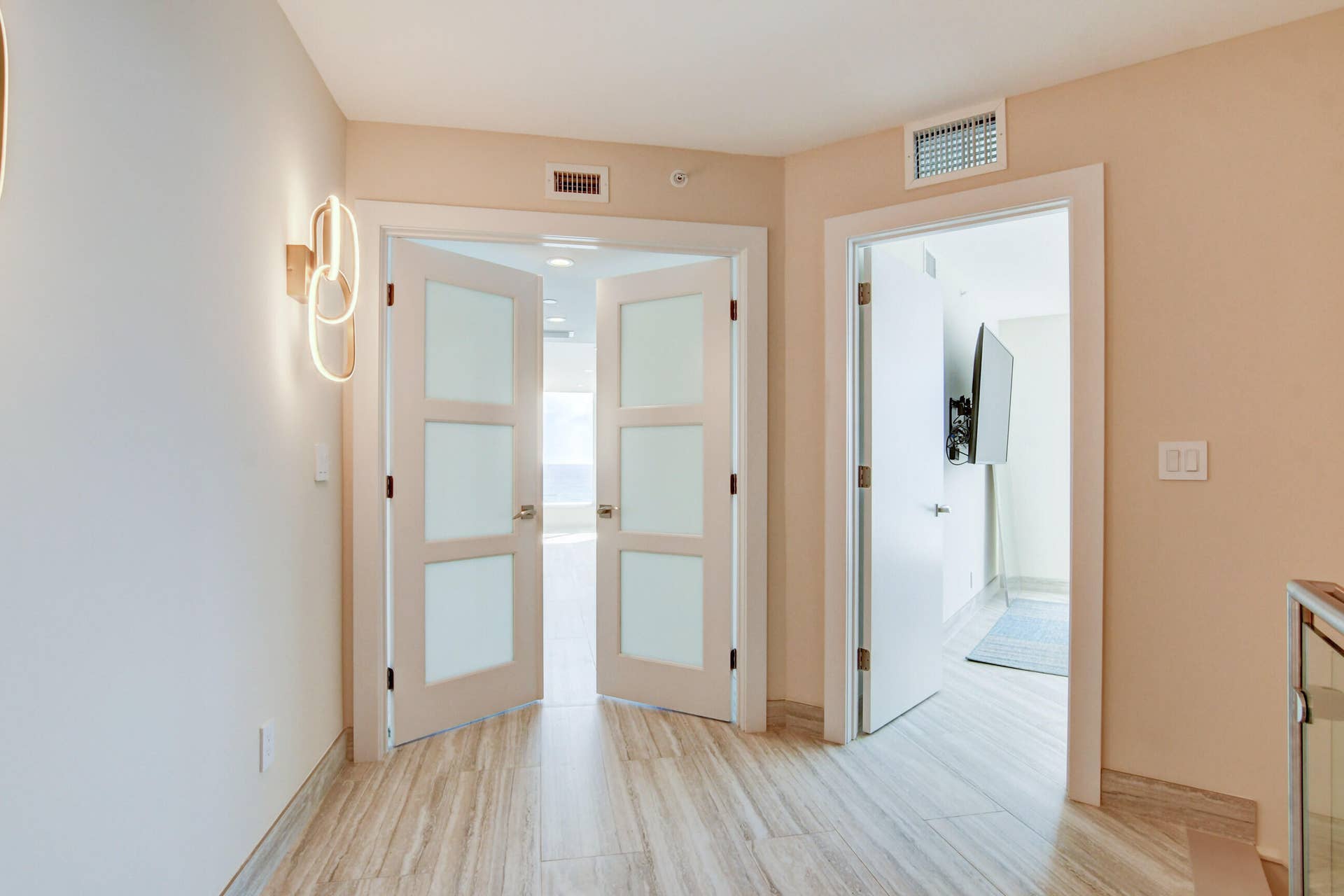 Frosted Glass doors upon entering the Master Suite, Guest BR on right side of entry.