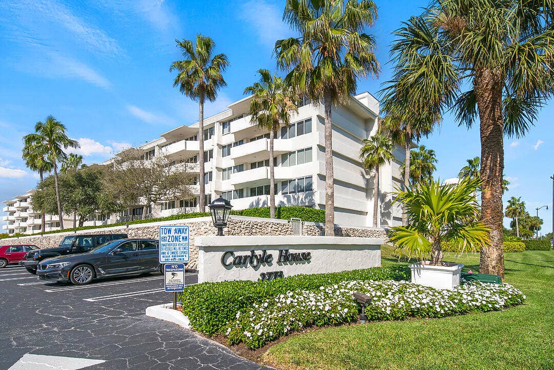 2773 S Ocean Boulevard, #517, Palm Beach, Palm Beach, FL 33480 Building exterior with multiple balconies, surrounded by mature palm trees