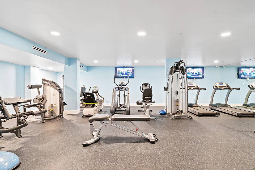 2773 S Ocean Boulevard, #517, Palm Beach, Palm Beach, FL 33480 Fitness room featuring recessed lighting, light blue walls, and rubberized flooring