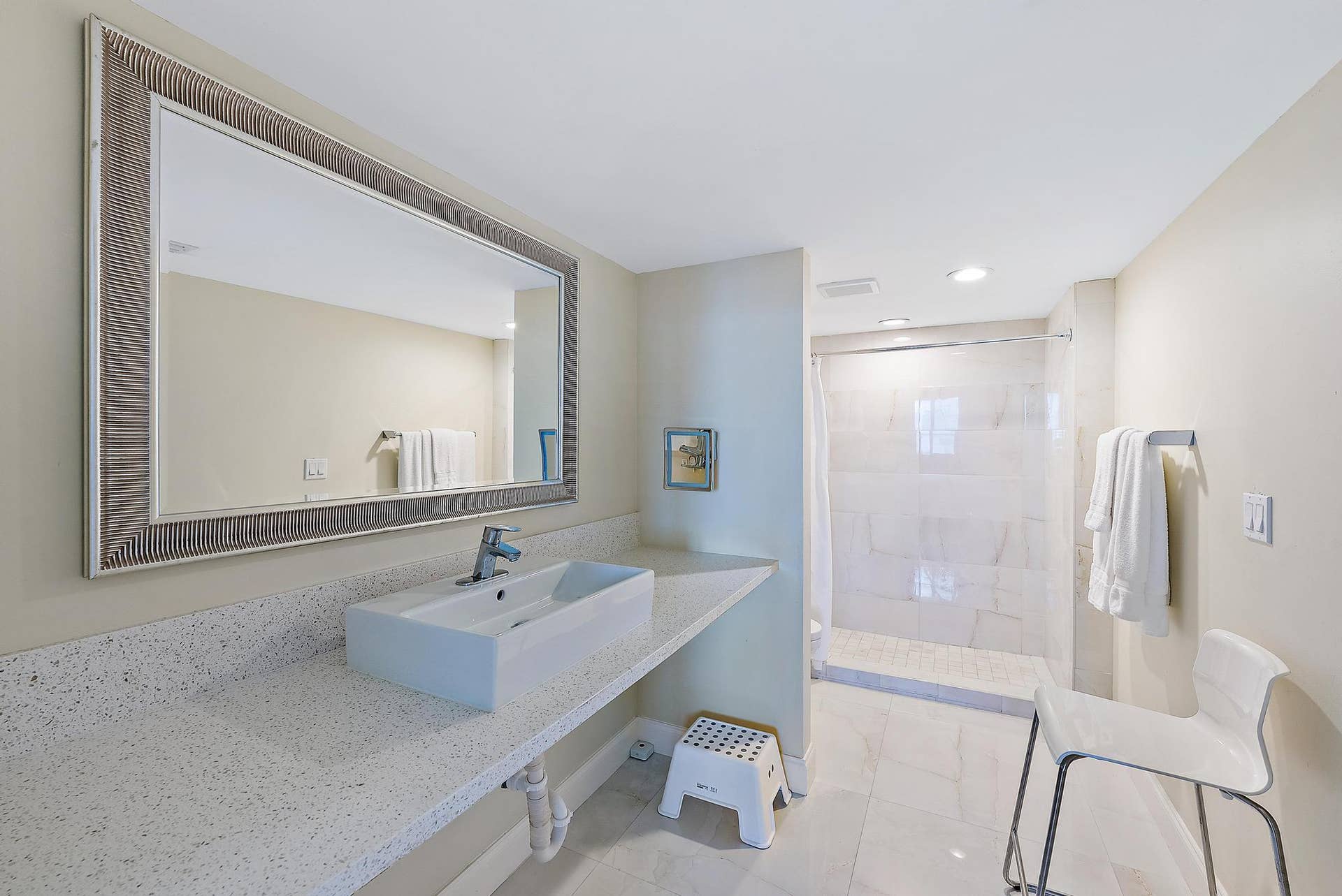 2773 S Ocean Boulevard, #517, Palm Beach, Palm Beach, FL 33480 Spacious vanity with a rectangular vessel sink, expansive countertop, and large framed mirror
