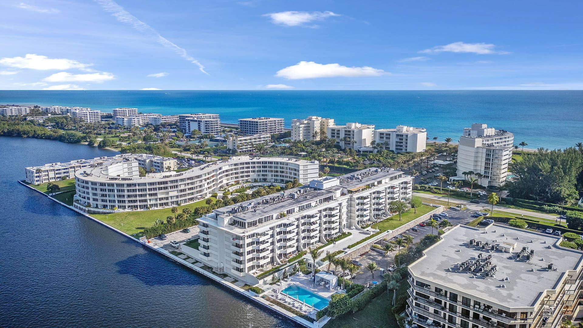 2773 S Ocean Boulevard, #517, Palm Beach, Palm Beach, FL 33480 Waterfront property with multiple residential buildings, outdoor swimming pool, and direct access to a large body of water