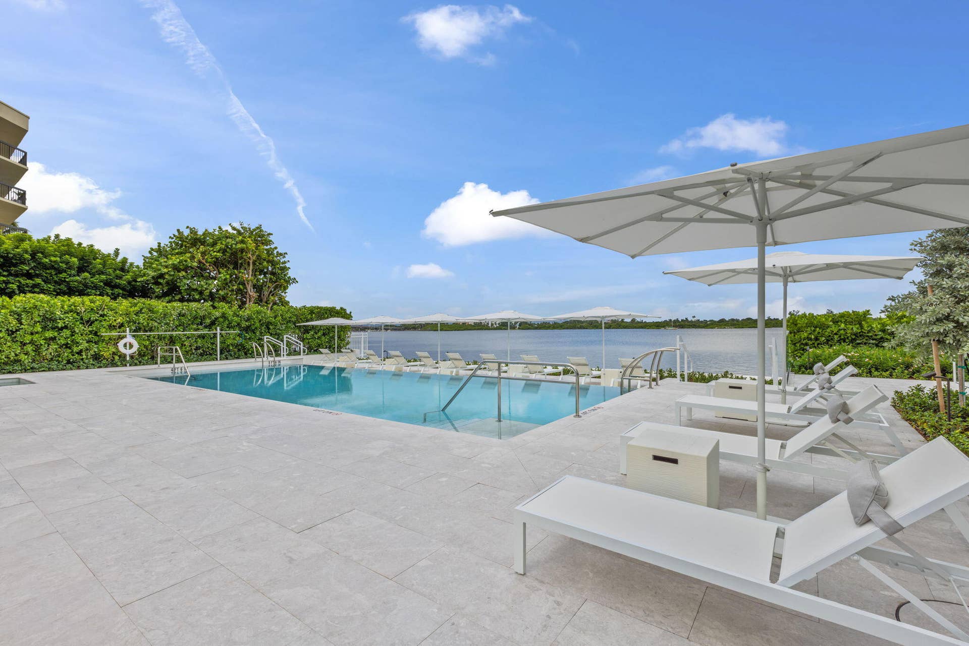 2773 S Ocean Boulevard, #517, Palm Beach, Palm Beach, FL 33480 Outdoor swimming pool with integrated steps, surrounded by a stone paver deck