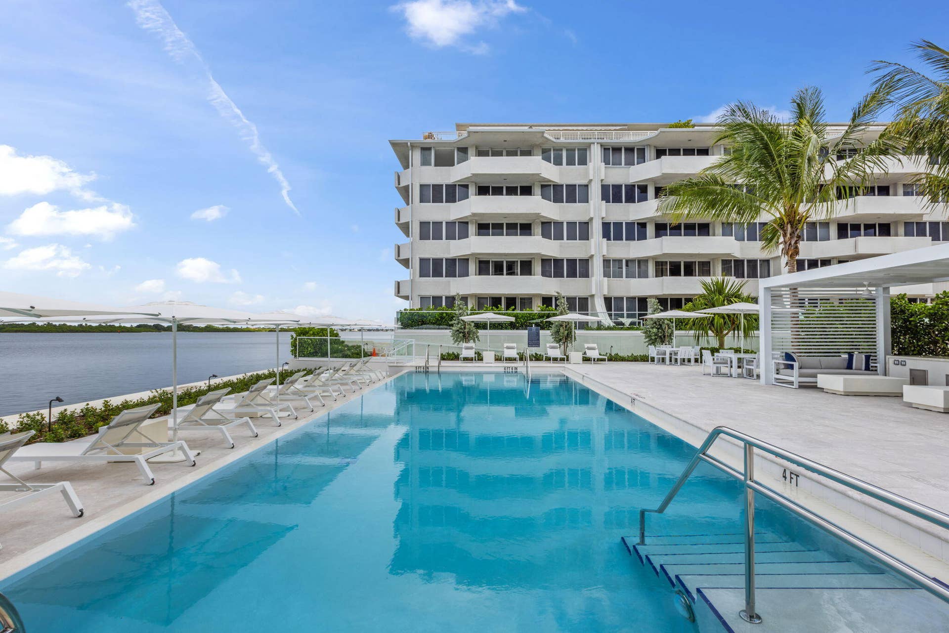 2773 S Ocean Boulevard, #517, Palm Beach, Palm Beach, FL 33480 Resort-style pool area featuring a rectangular swimming pool, integrated entry steps, and a surrounding paver deck