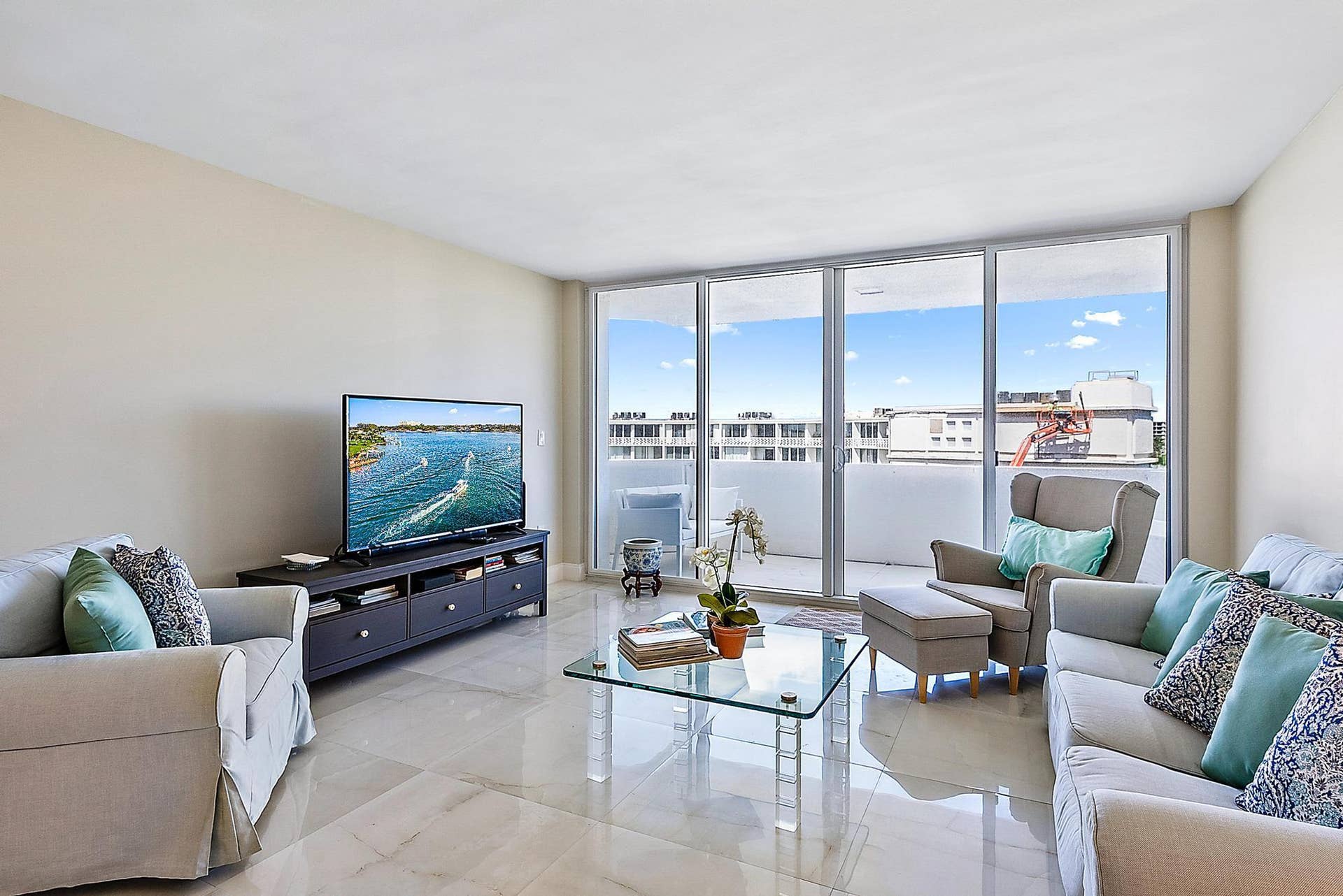 2773 S Ocean Boulevard, #517, Palm Beach, Palm Beach, FL 33480 Expansive glass sliding doors to balcony, light-toned wall color, and polished tile flooring