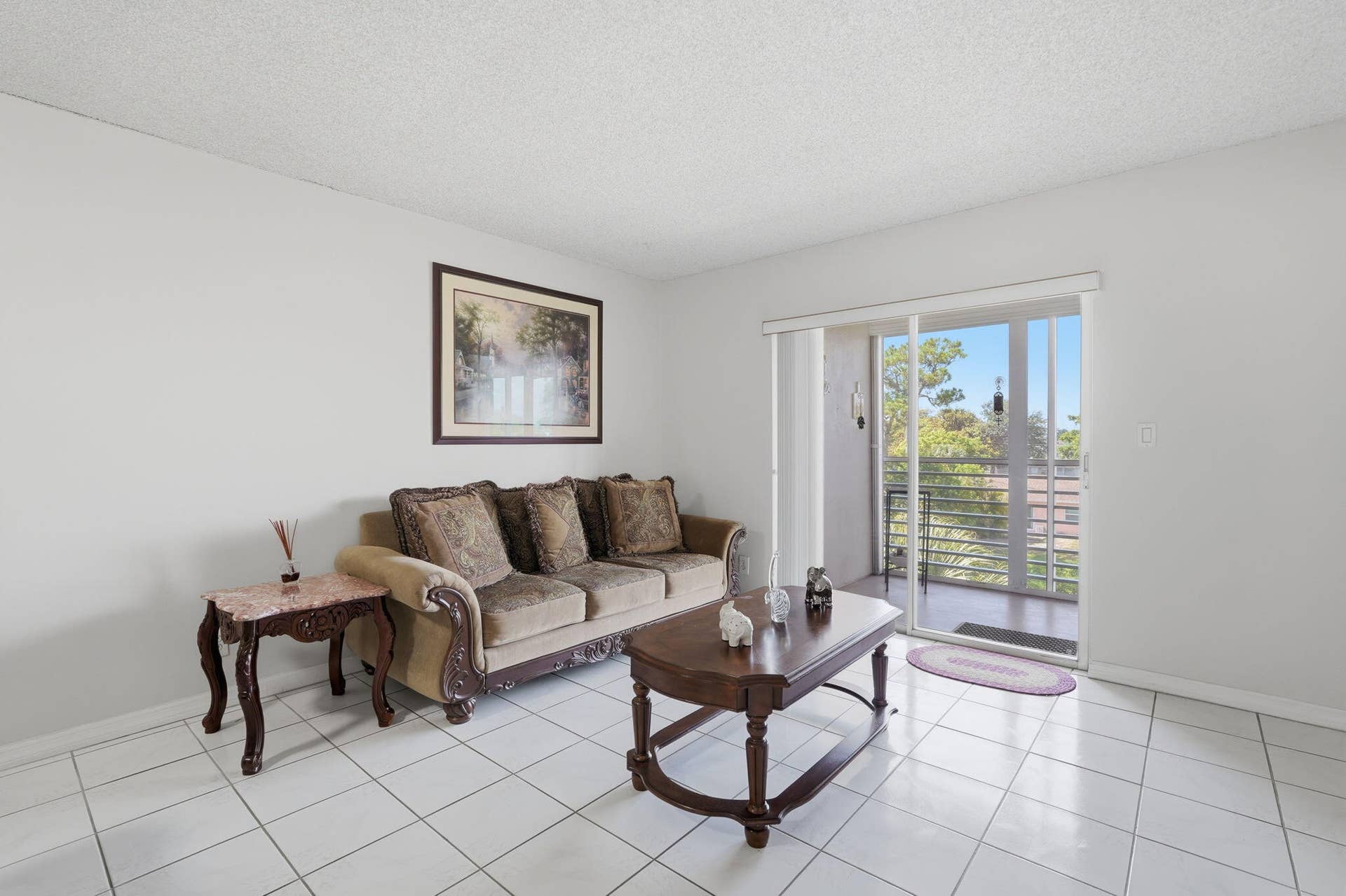 2606 Garden Drive S, #305, Lake Worth, FL 33461 Living room with sliders to balcony