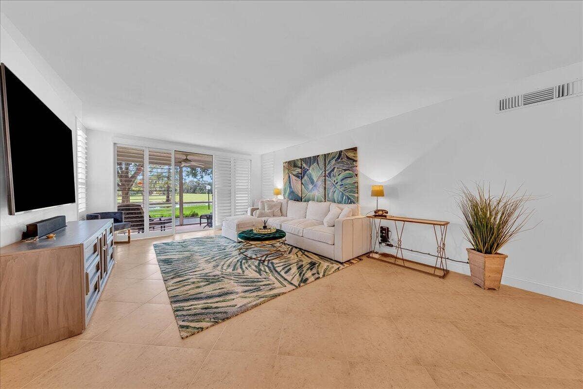 3505 Oaks Way, #109, Pompano Beach, FL 33069 Neutral tile on the diagonal throughout the condo
