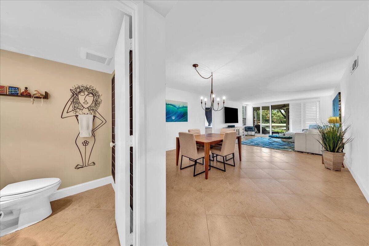 3505 Oaks Way, #109, Pompano Beach, FL 33069 Dining room and half bath