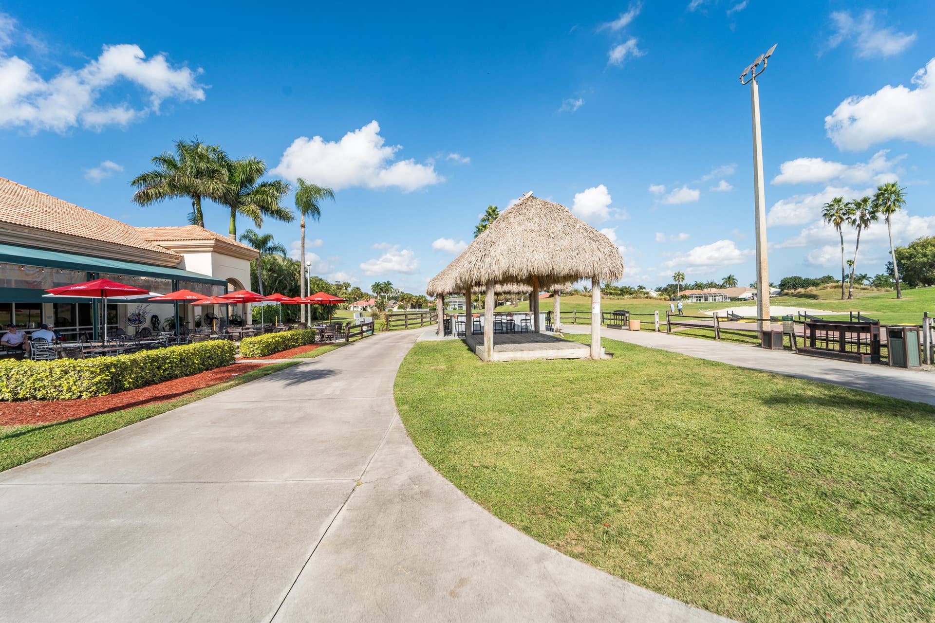 6801 Las Colinas Lane, Lake Worth, FL 33463 Back of restaurant with patio to dine and Tiki bars and on occasion live music