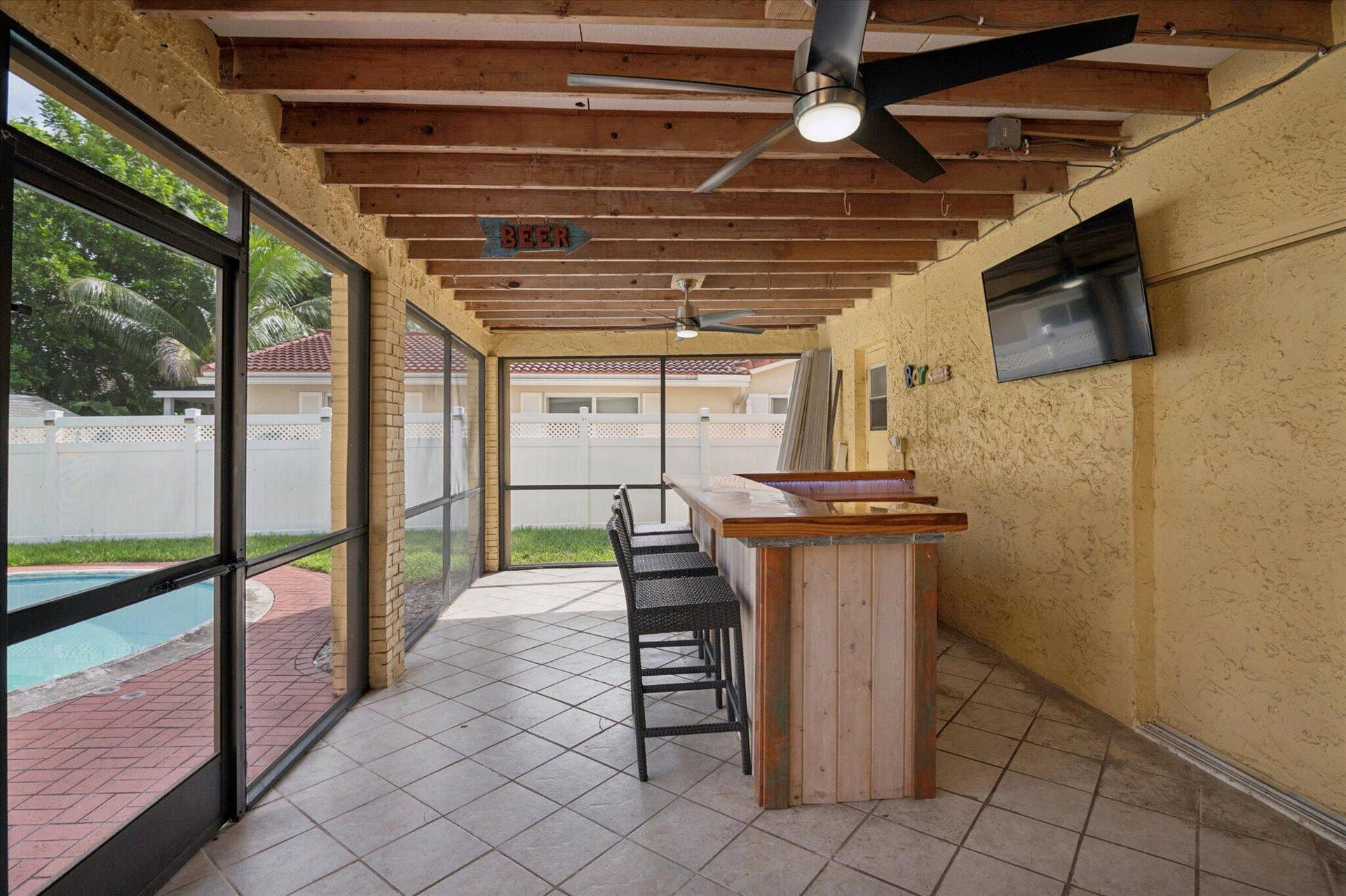 11913 NW 31st Street, Coral Springs, FL 33065 Covered and Screened Patio with Custom Bar