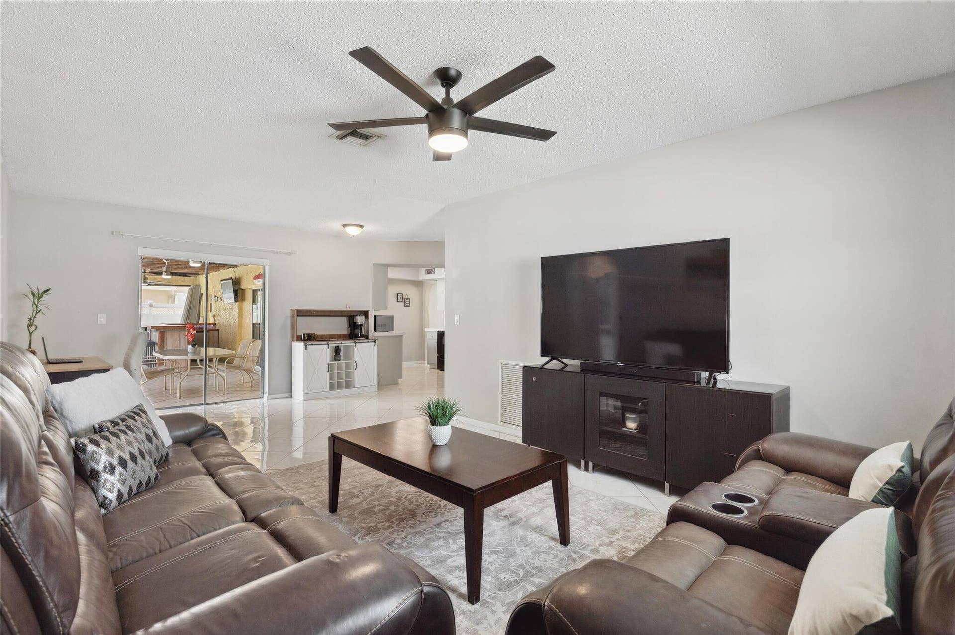 11913 NW 31st Street, Coral Springs, FL 33065 Living Room with views of patio