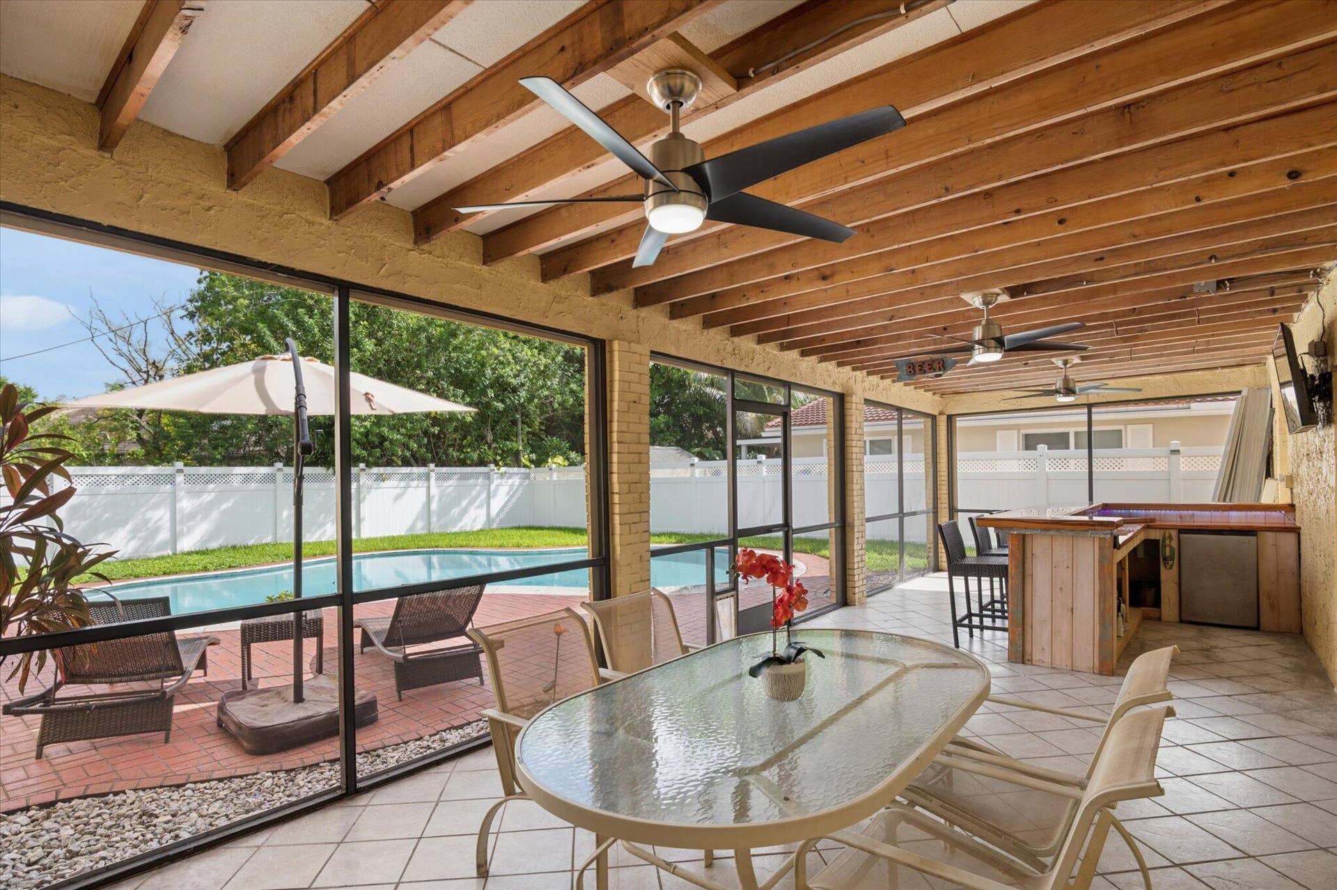 11913 NW 31st Street, Coral Springs, FL 33065 Screened Patio with ample room for table, sofa, and extra covered seating