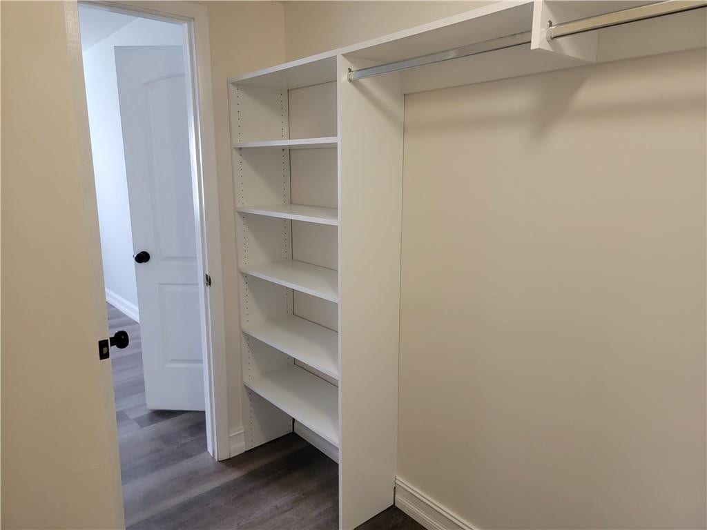 1001 SE 6TH Avenue, #127, Deerfield Beach, Deerfield Beach, FL 33441 Built-in shelving with adjustable shelves, integrated clothing rod, and wood-finish flooring