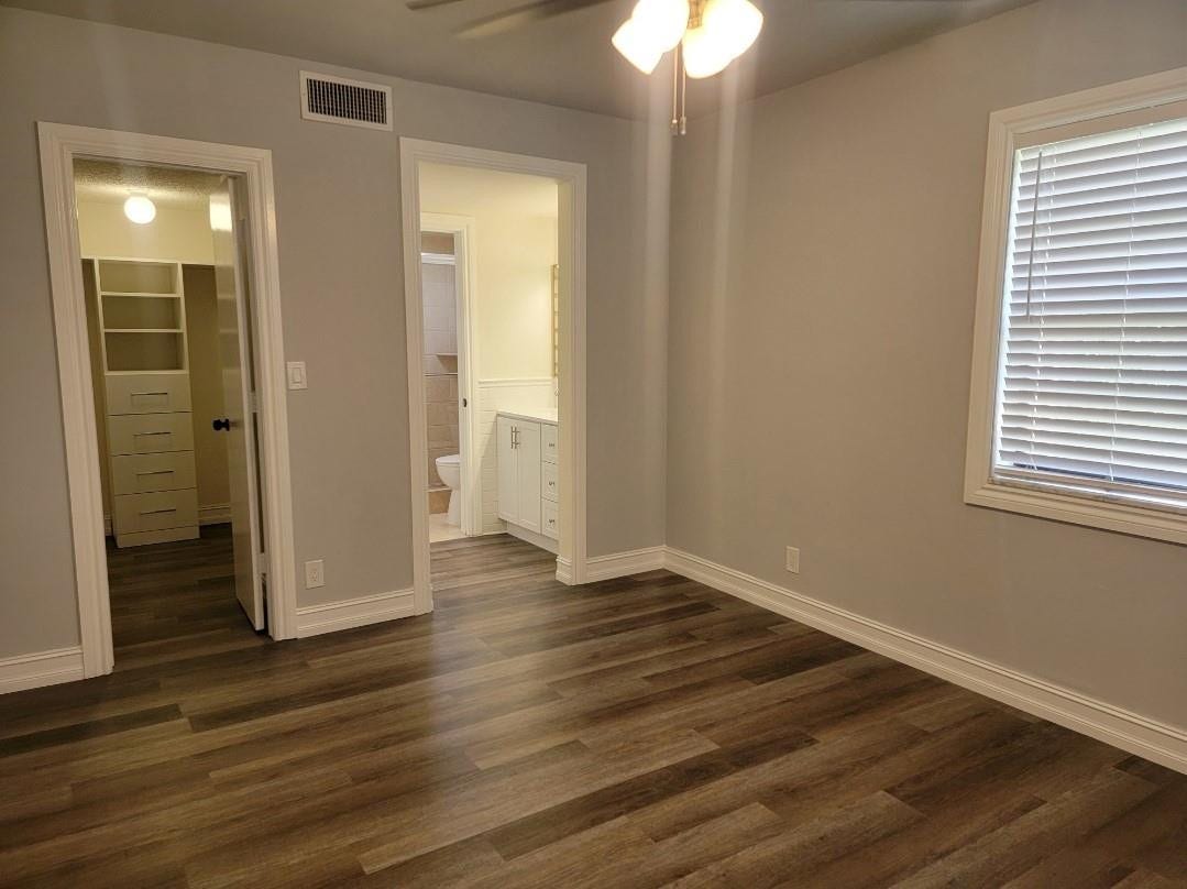1001 SE 6TH Avenue, #127, Deerfield Beach, Deerfield Beach, FL 33441 Wood-finish flooring, ceiling fan with light fixture, window with blinds, and neutral wall tones