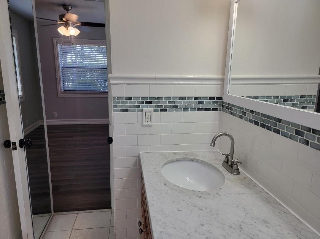 1001 SE 6TH Avenue, #127, Deerfield Beach, Deerfield Beach, FL 33441 Vanity with an integrated sink, polished chrome faucet, and stone countertop
